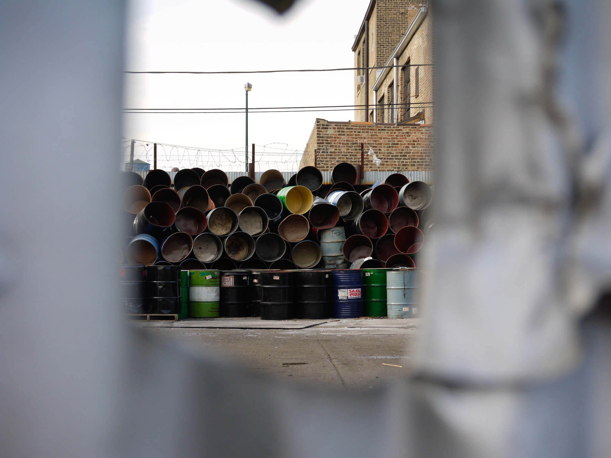 Panasonic Lumix G Vario 45-200mm F4-5.6 OIS sample photo. Barrels through the cracks photography