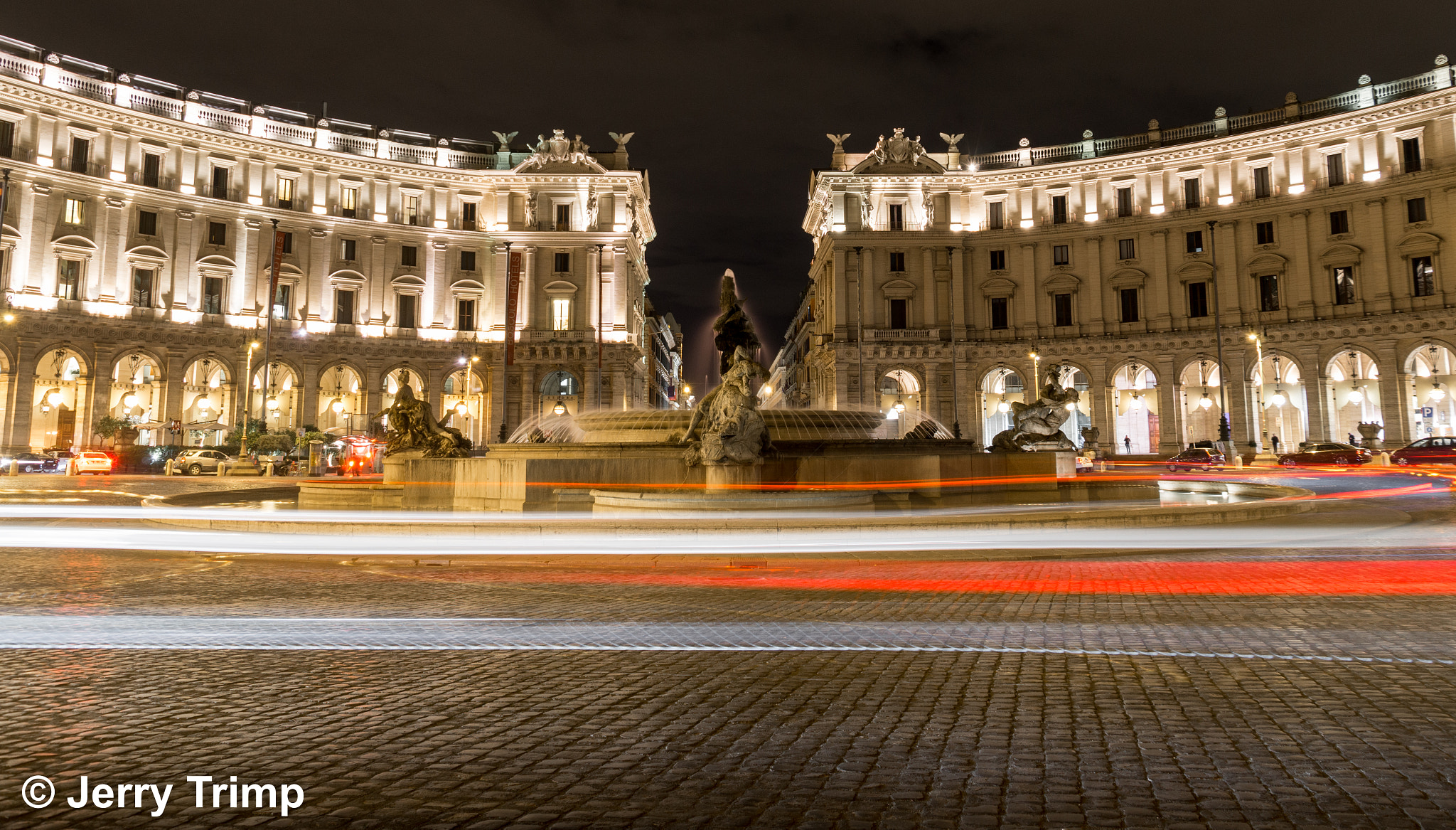Sony SLT-A58 + Sigma 18-200mm F3.5-6.3 DC sample photo. Light trails around the fountain photography