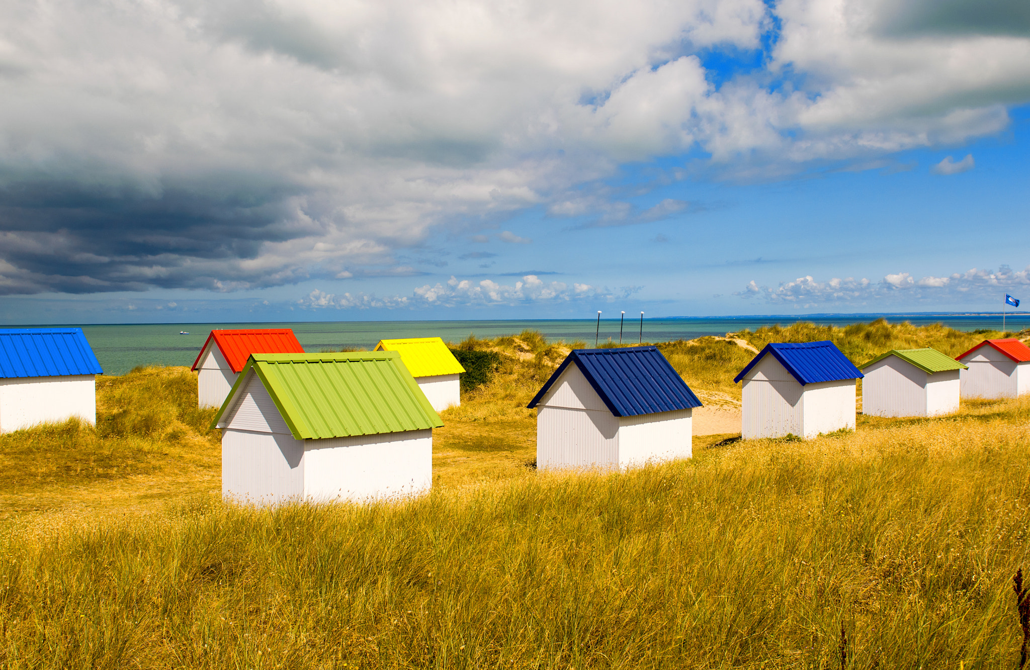 Nikon AF-S Nikkor 24-70mm F2.8G ED sample photo. Colourful houses on the beach photography