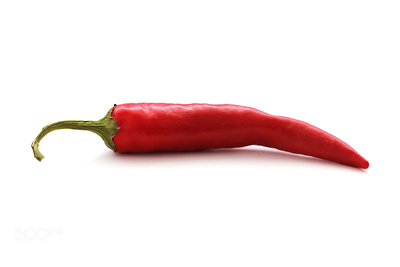 Canon EOS 550D (EOS Rebel T2i / EOS Kiss X4) + Canon EF 100mm F2.8L Macro IS USM sample photo. Red chilli isolated on white photography