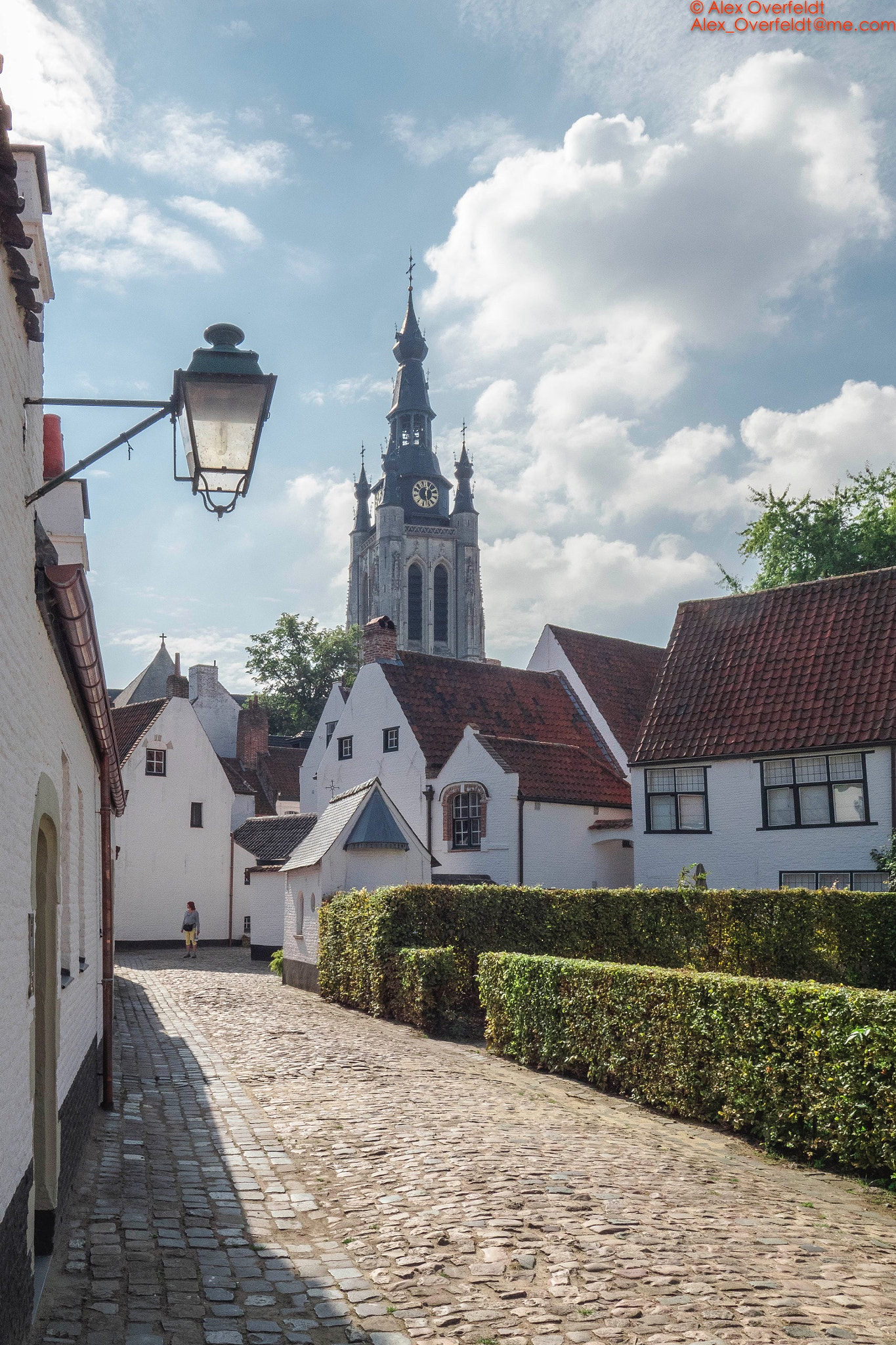 Olympus PEN-F sample photo. Kortrijk begijnhof on a sunny day with view on saint martinus church tower photography