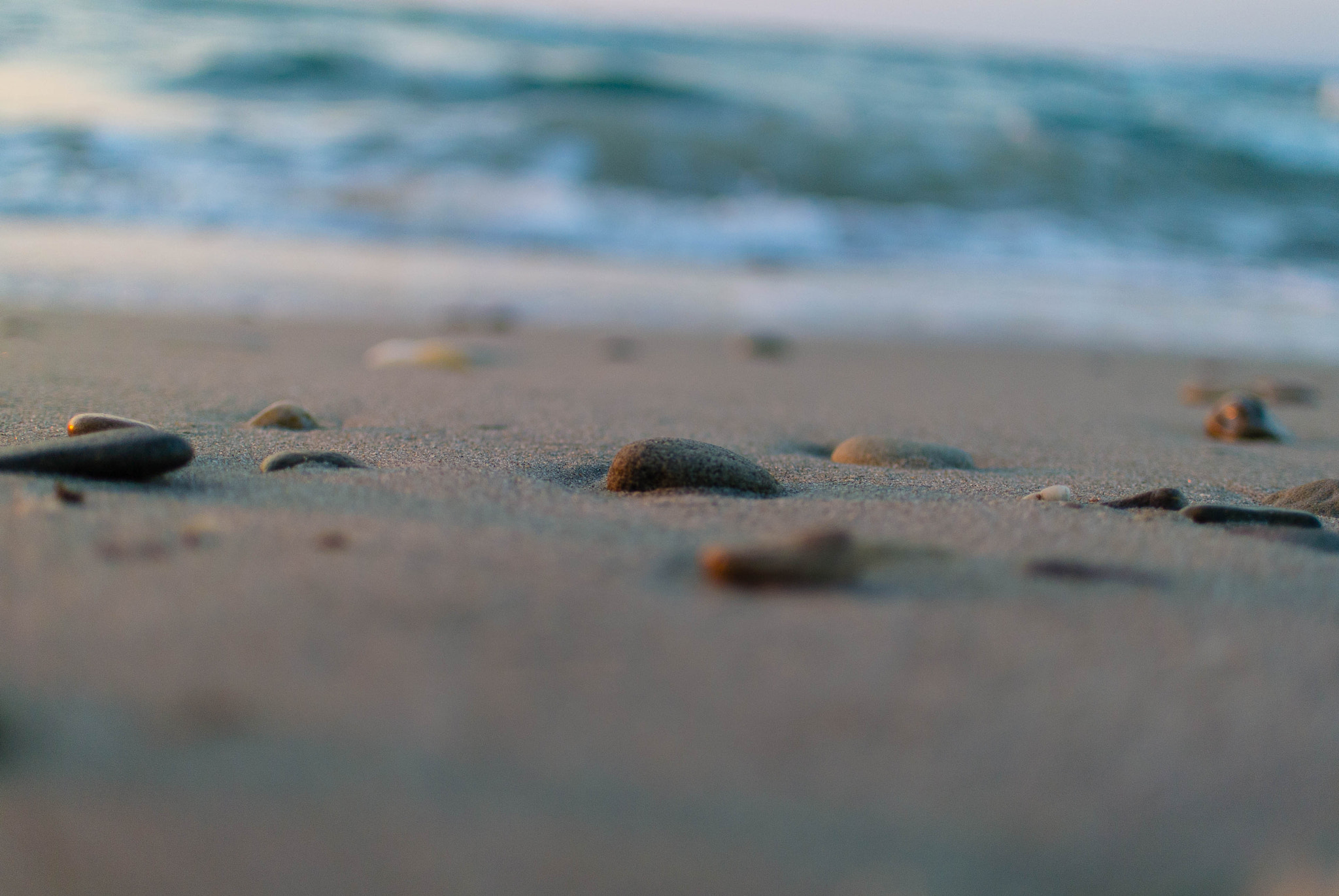 Nikon 1 V1 + Nikon 1 Nikkor 18.5mm F1.8 sample photo. Stones on the beach photography