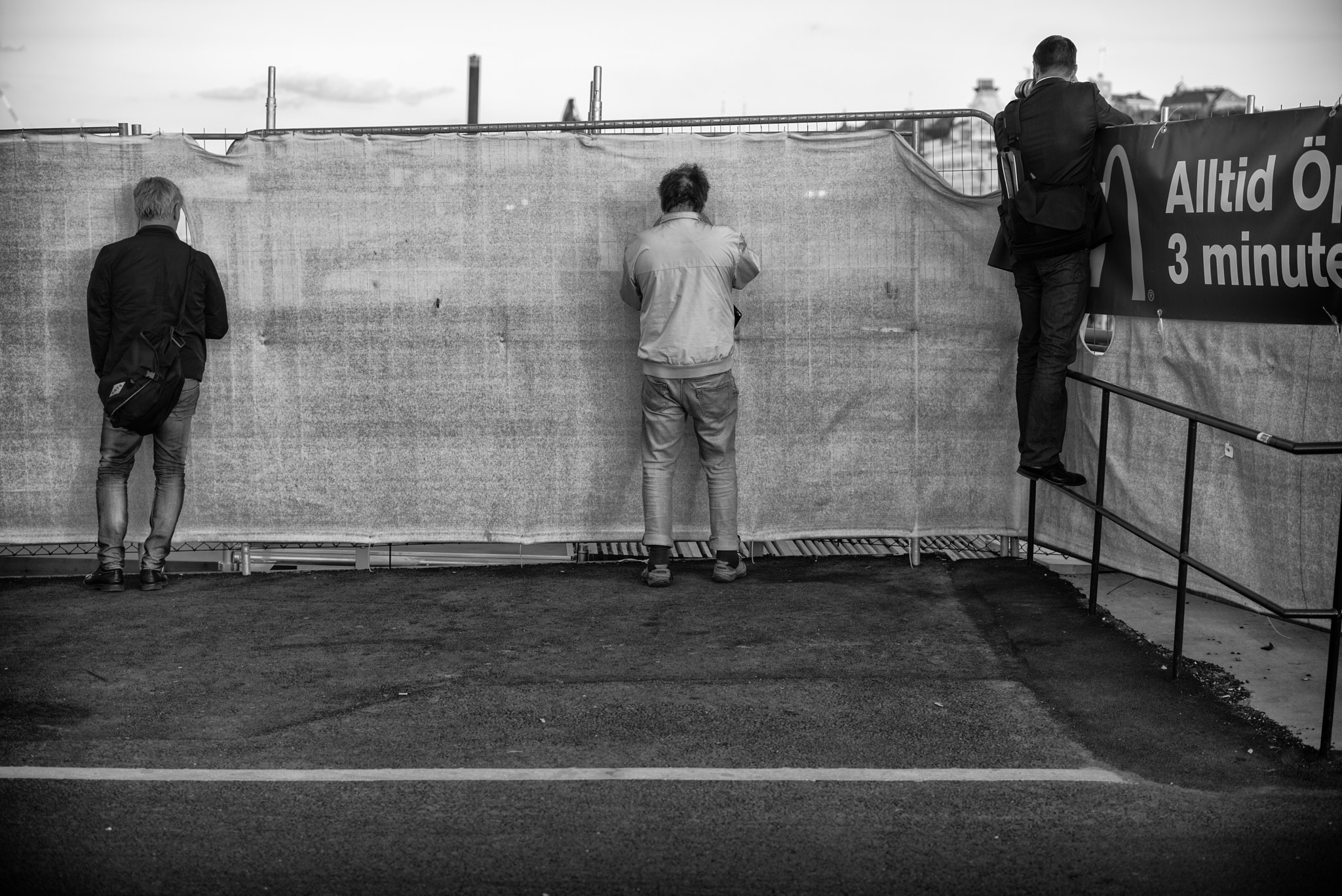 Leica APO-Summicron-M 50mm F2 ASPH sample photo. Three men in a row photography