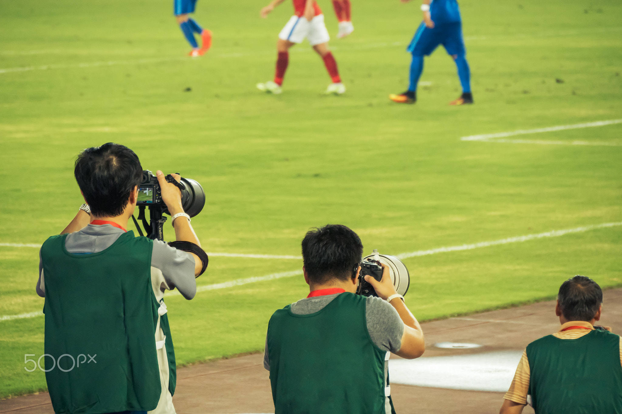 reporters taking photos in a row