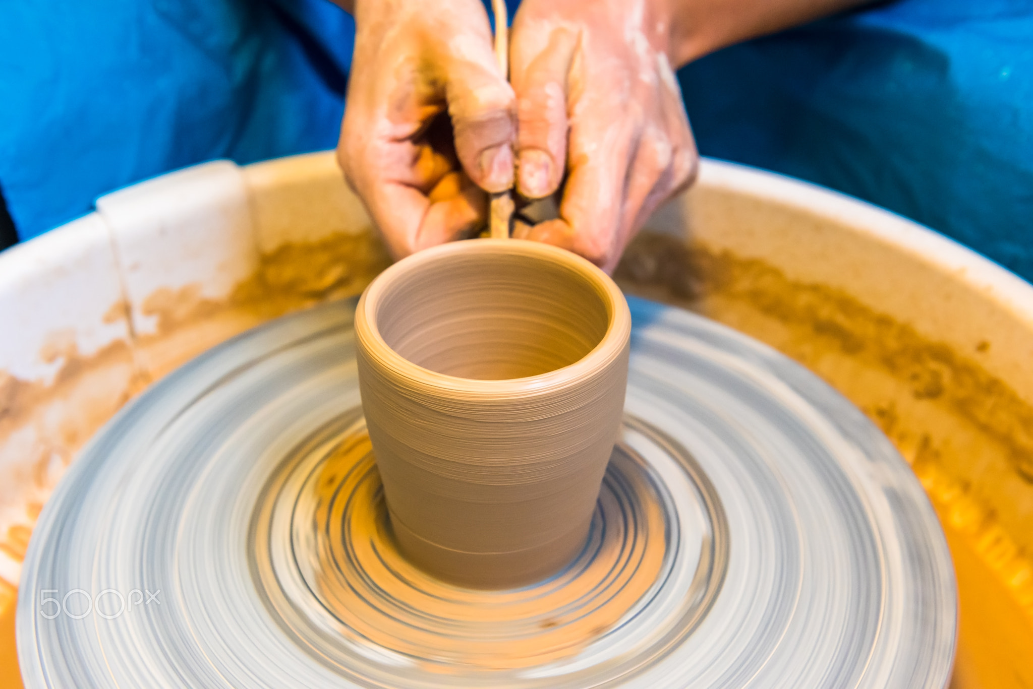 Pottering - creating a clay cup in process