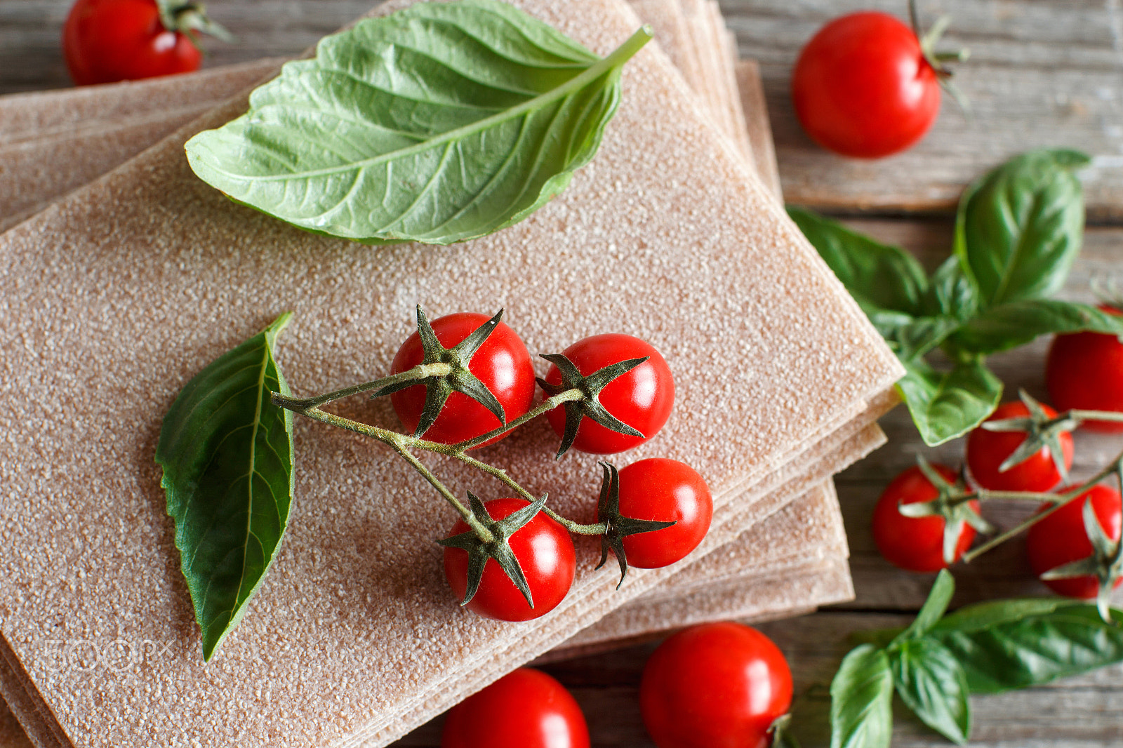 Canon EOS 650D (EOS Rebel T4i / EOS Kiss X6i) + Canon EF 50mm F1.2L USM sample photo. Raw lasagna sheets,basil and cherry tomatoes photography