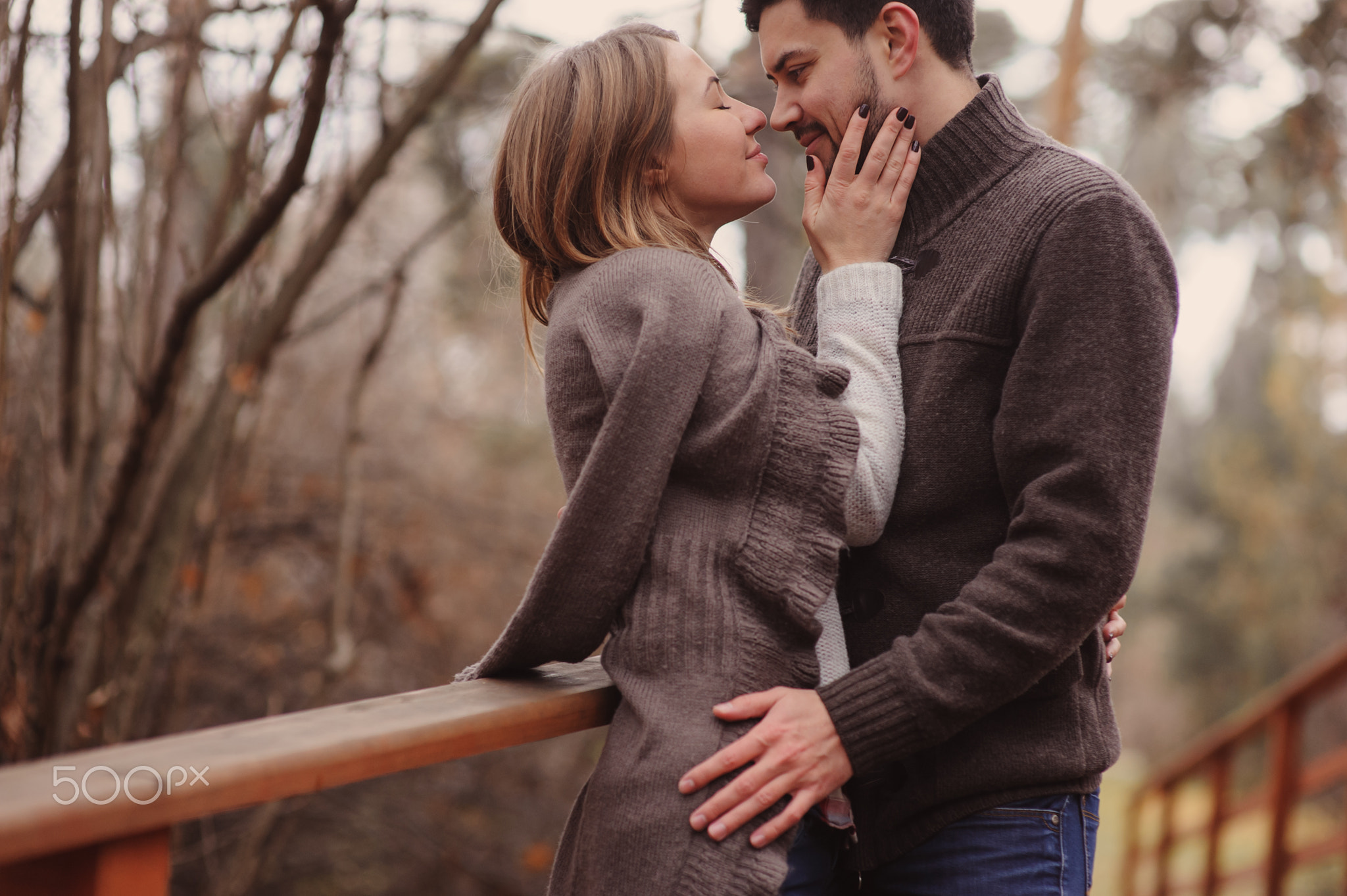 loving young couple happy together outdoor on cozy warm walk in autumn forest
