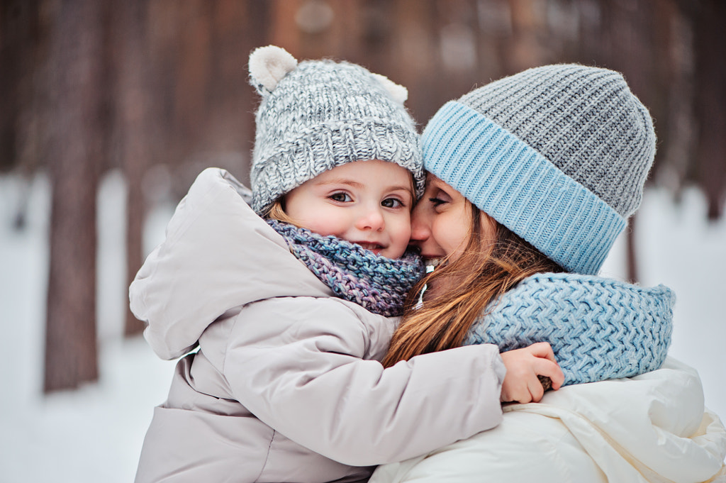 happy mother and baby daughter walking in winter by Maria Kovalevskaya on 500px.com