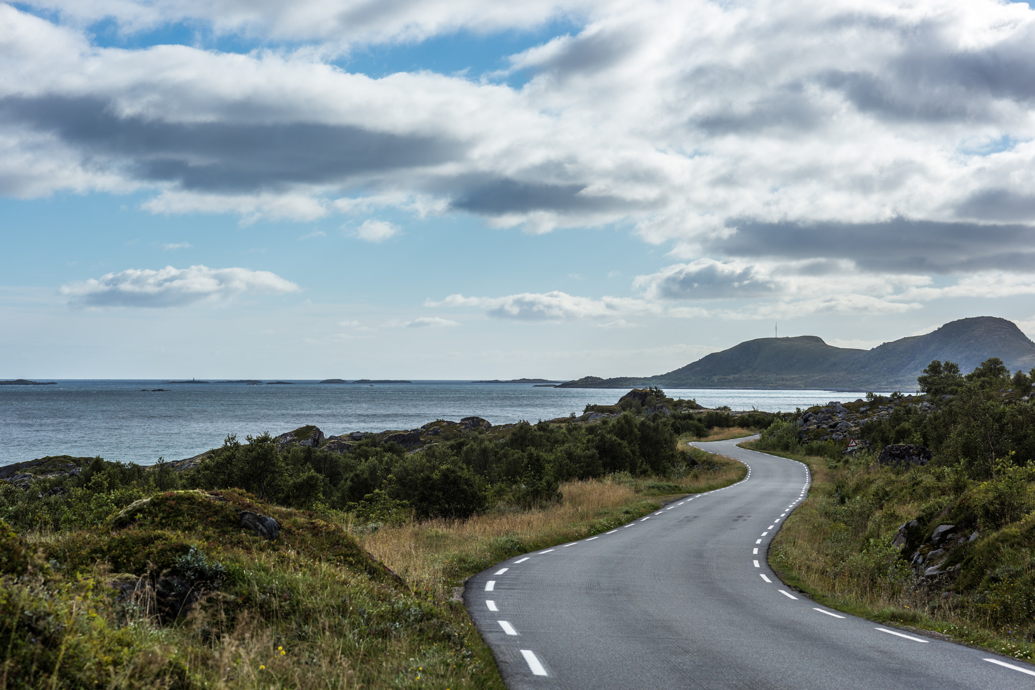 Nikon D810 + Nikon AF Nikkor 85mm F1.8D sample photo. Curvy country road along the coast. photography