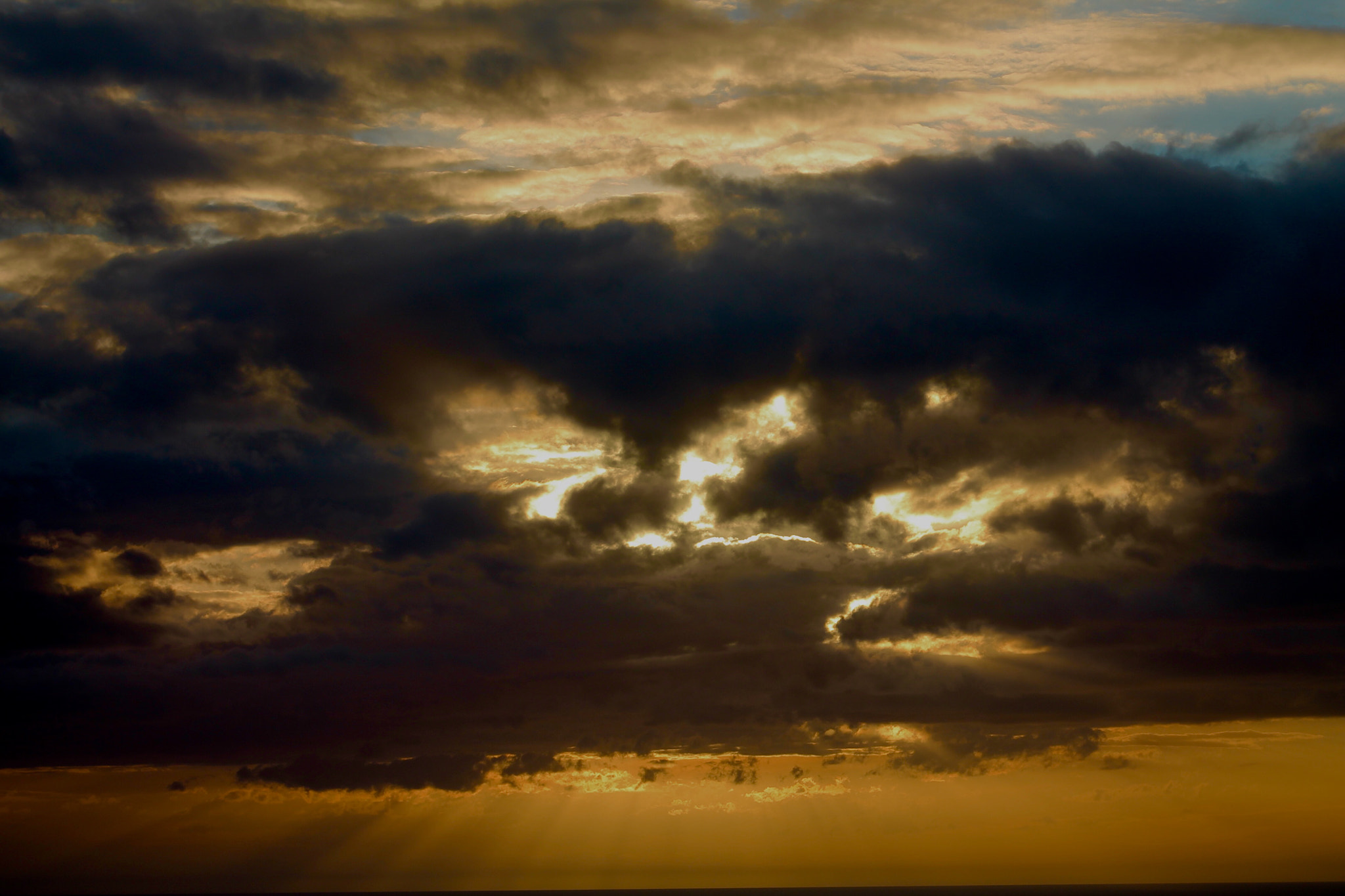 Canon EF75-300mm f/4-5.6 sample photo. Angry sky's fighting at sunset photography
