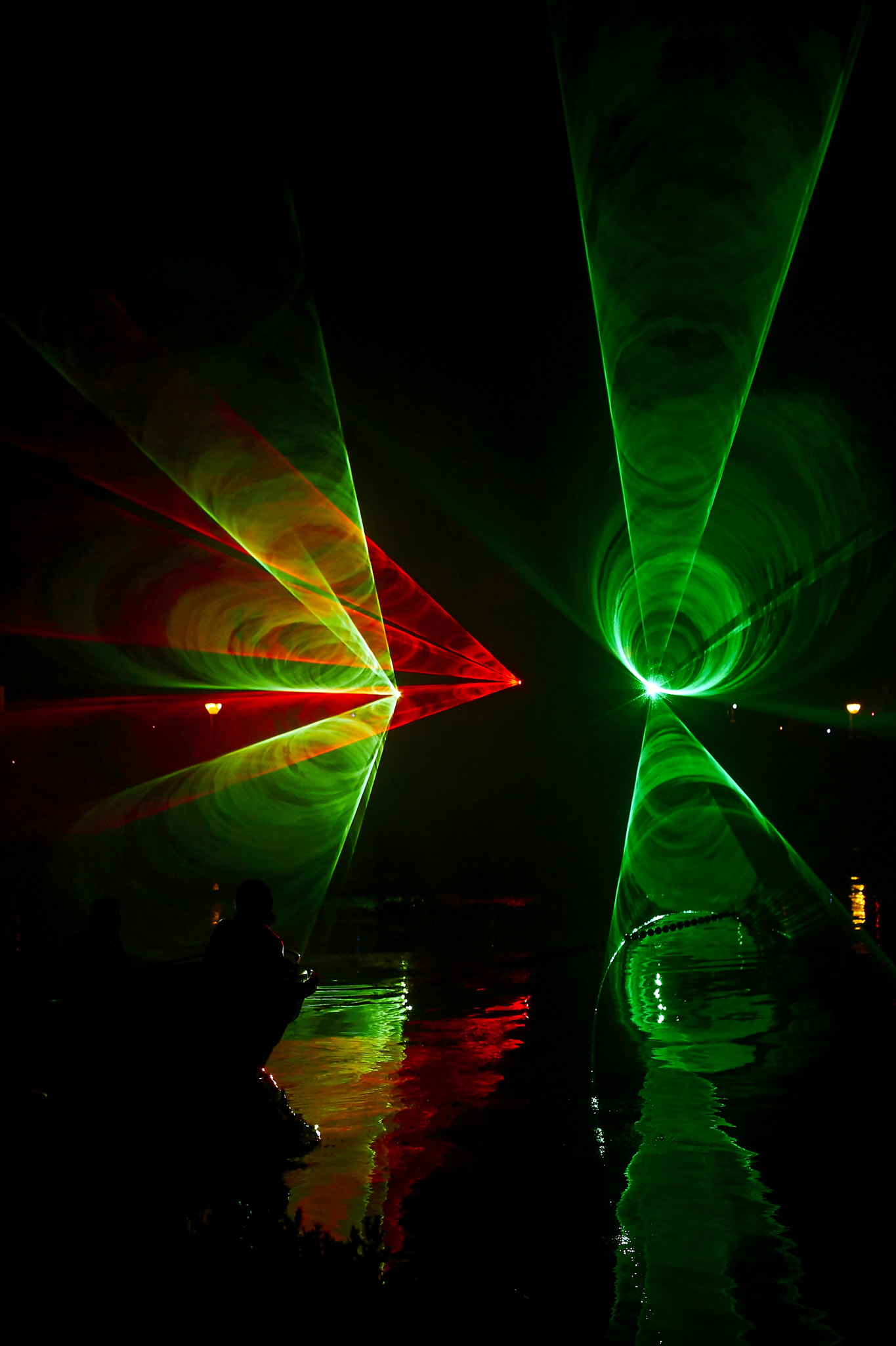 Sony ILCA-77M2 sample photo. Laser show on the river photography