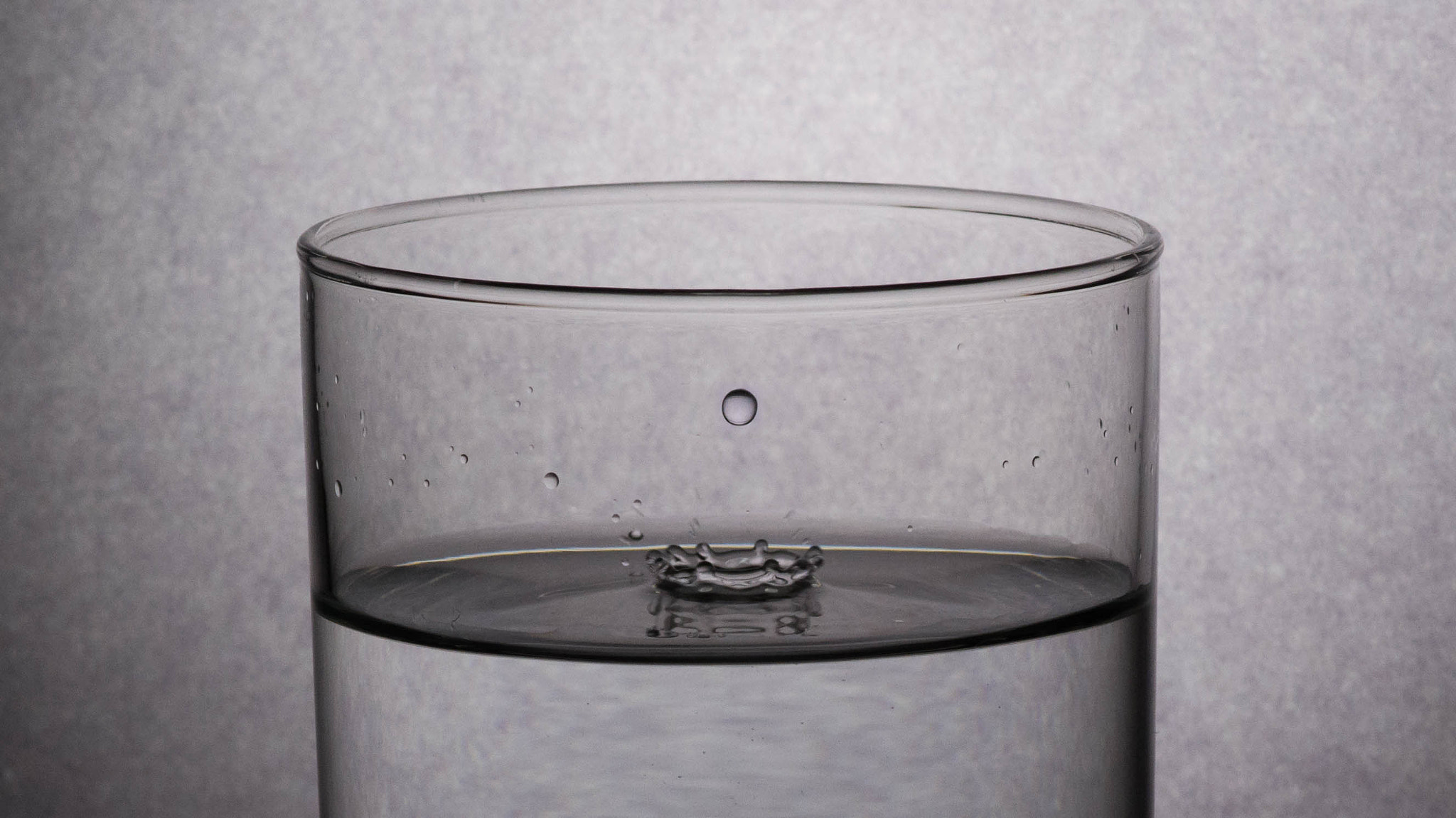 Nikon AF-S DX Micro-Nikkor 85mm F3.5G ED VR sample photo. Water collision photography