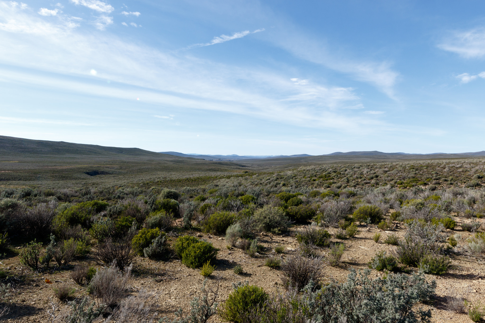 Canon EOS 7D Mark II sample photo. Clouds pointing to the endless wonder of tankwa karoo photography