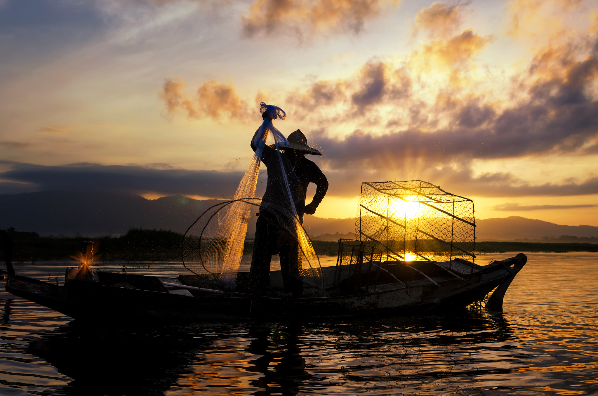 Nikon AF-S Nikkor 24-120mm F4G ED VR sample photo. Silhouettes of the traditional stilt fishermen at sunset. photography