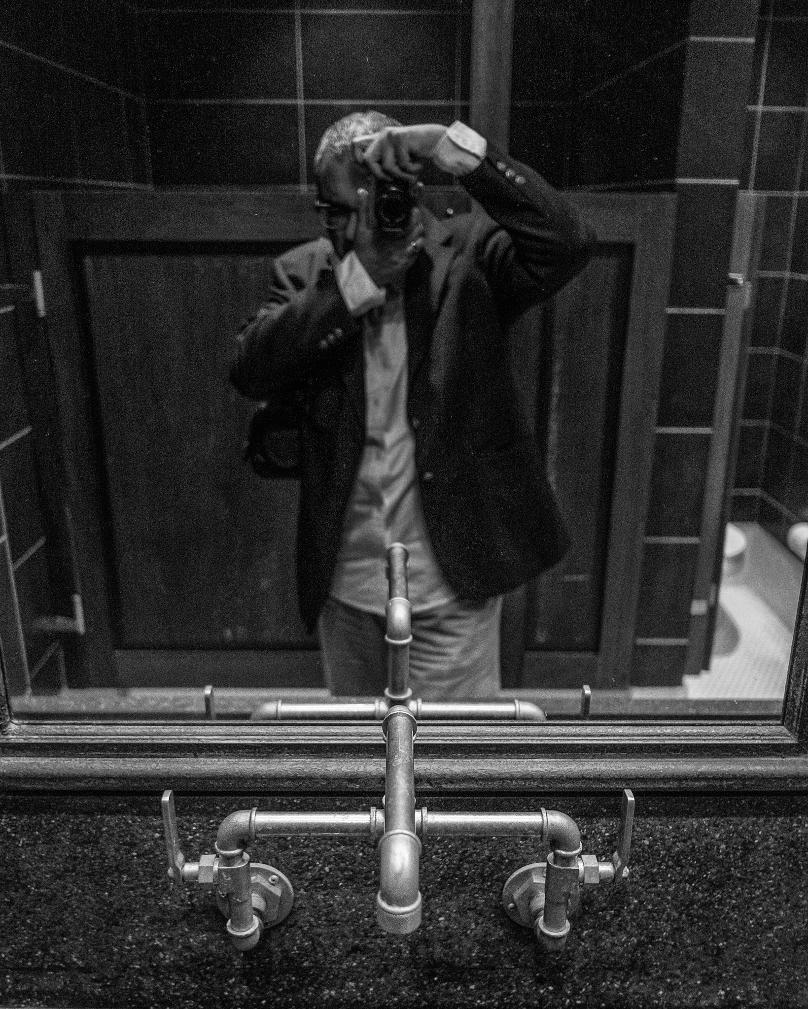 Fujifilm X-E2 + Fujifilm XF 18mm F2 R sample photo. Obsessed. with taking interesting photos. sharp faucet in men's room. pun intended. photography