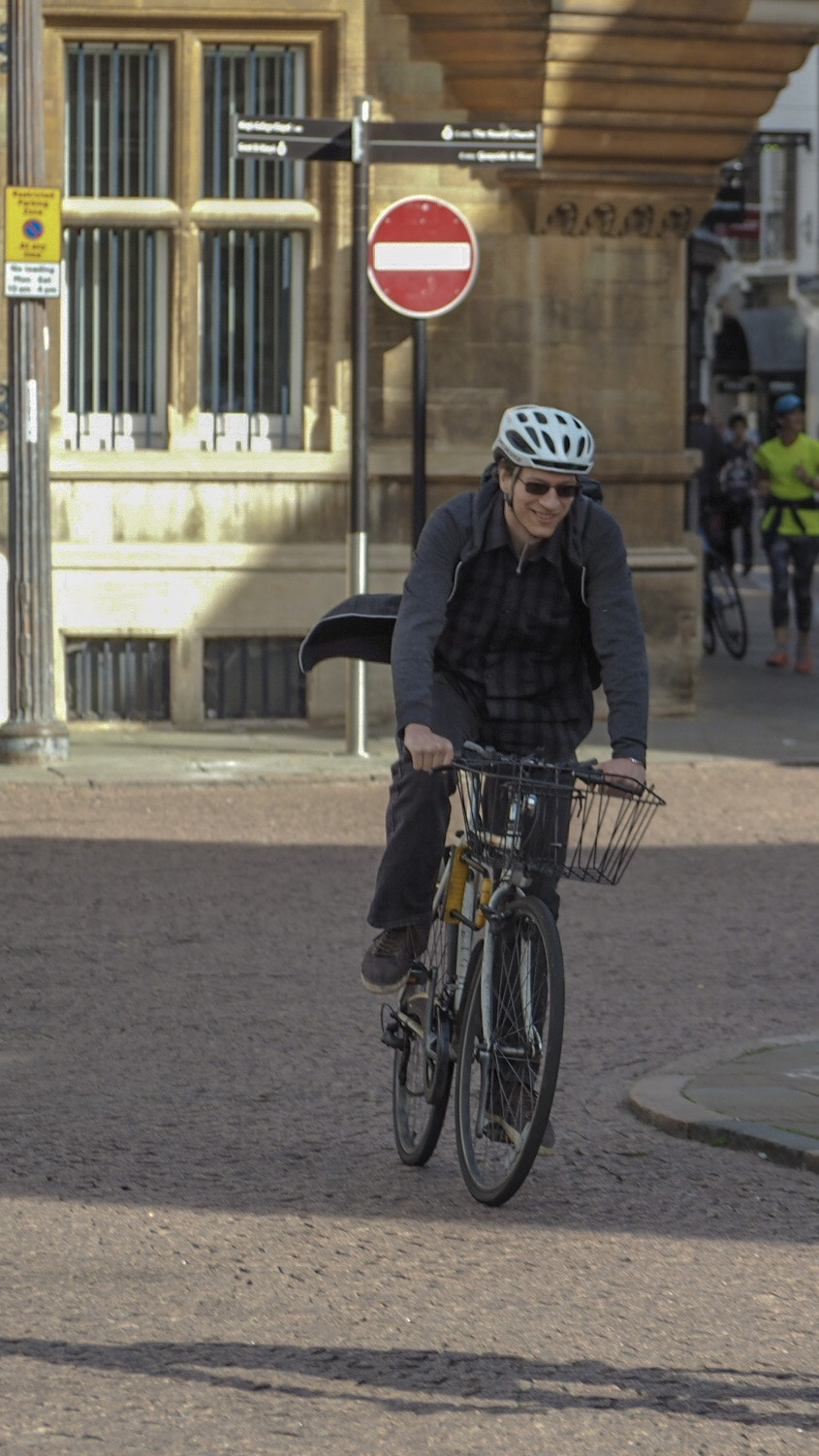 Olympus PEN E-PL7 sample photo. A happy cyclist. another photo from my olympus photowalk in cambridge. photography