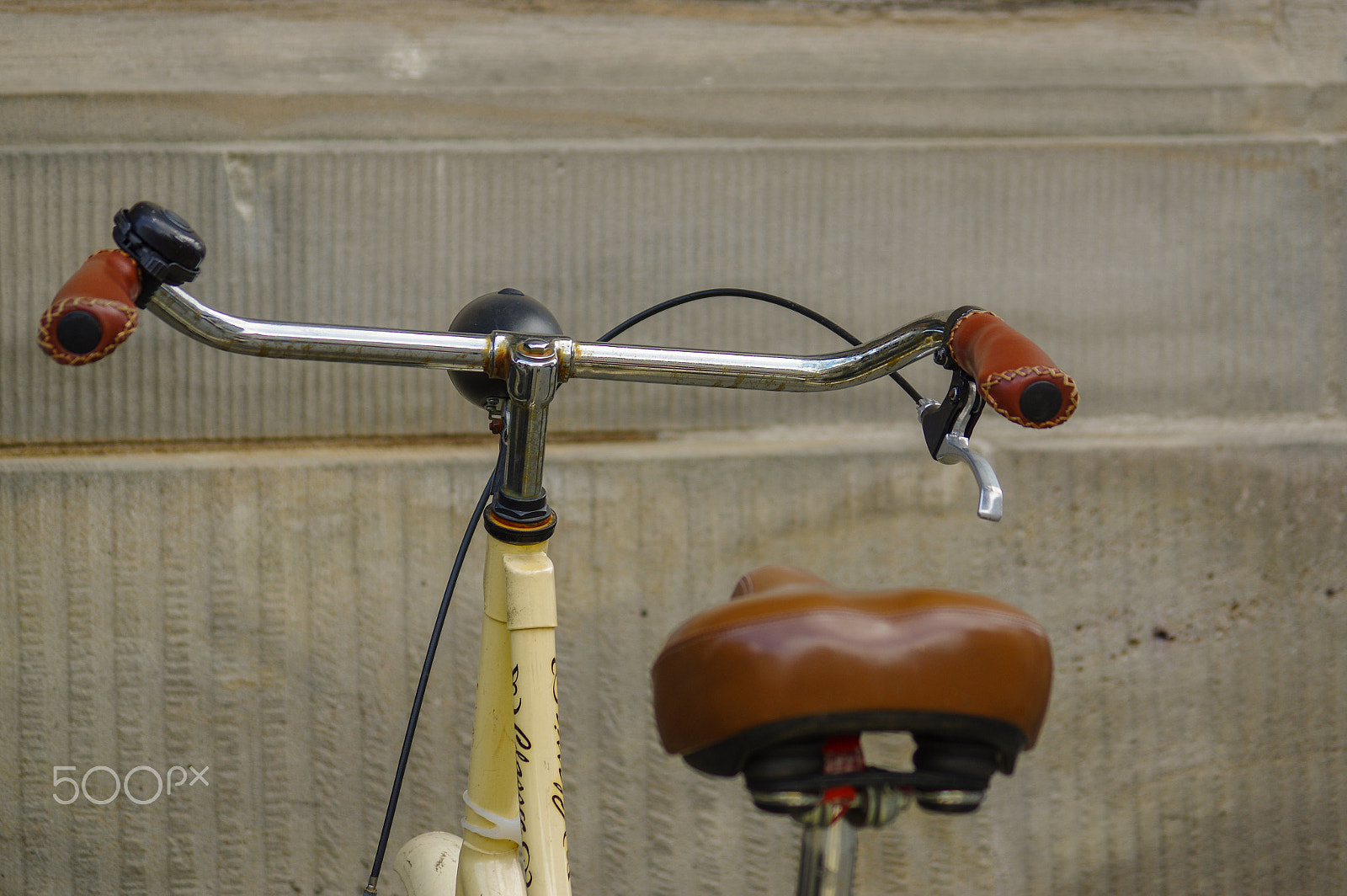 Pentax K-3 sample photo. Details of old yellow bicycle. leather seat with shock absorbers and wheel photography