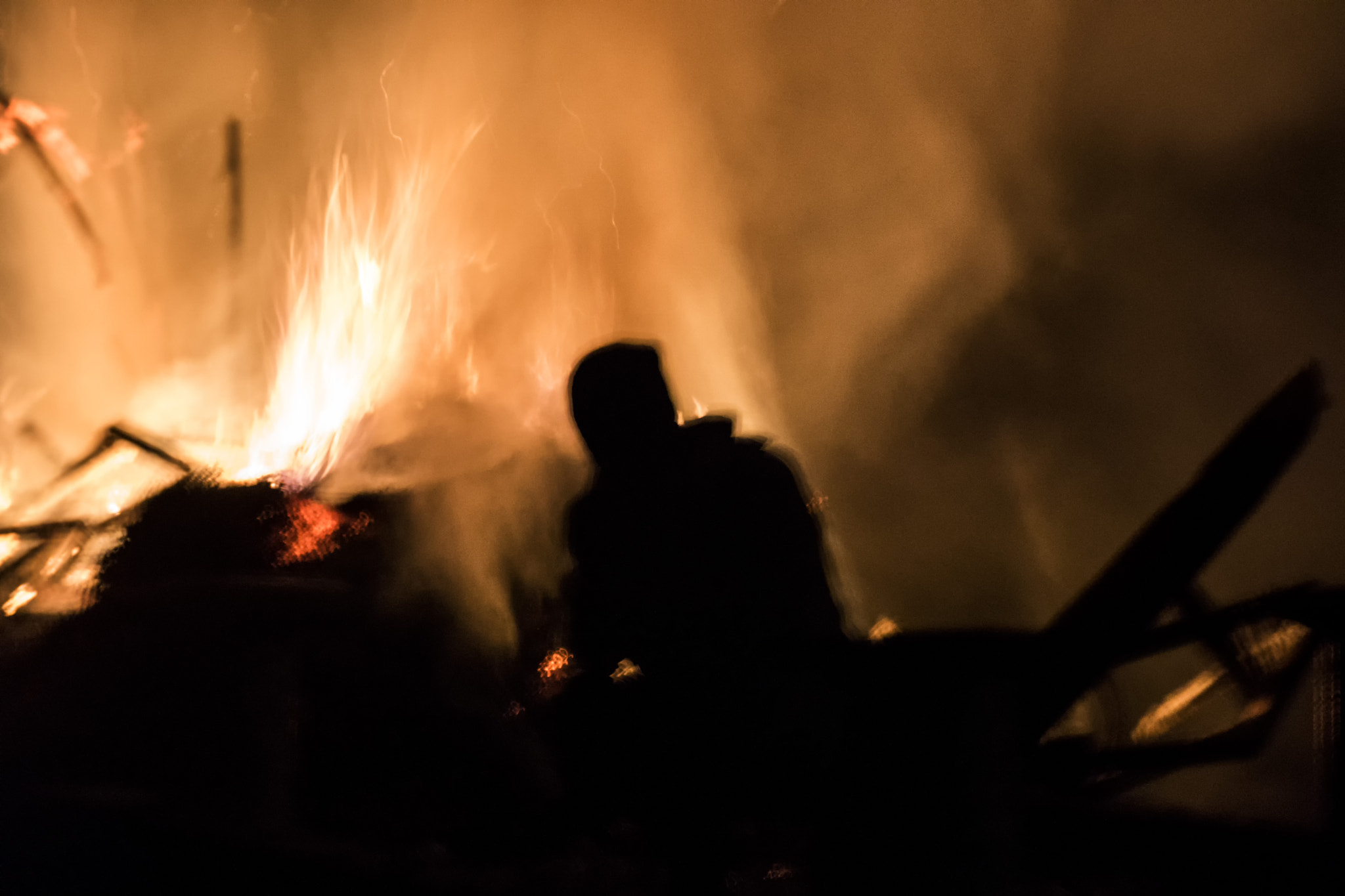 Sony DT 18-200mm F3.5-6.3 sample photo. Man and fire photography