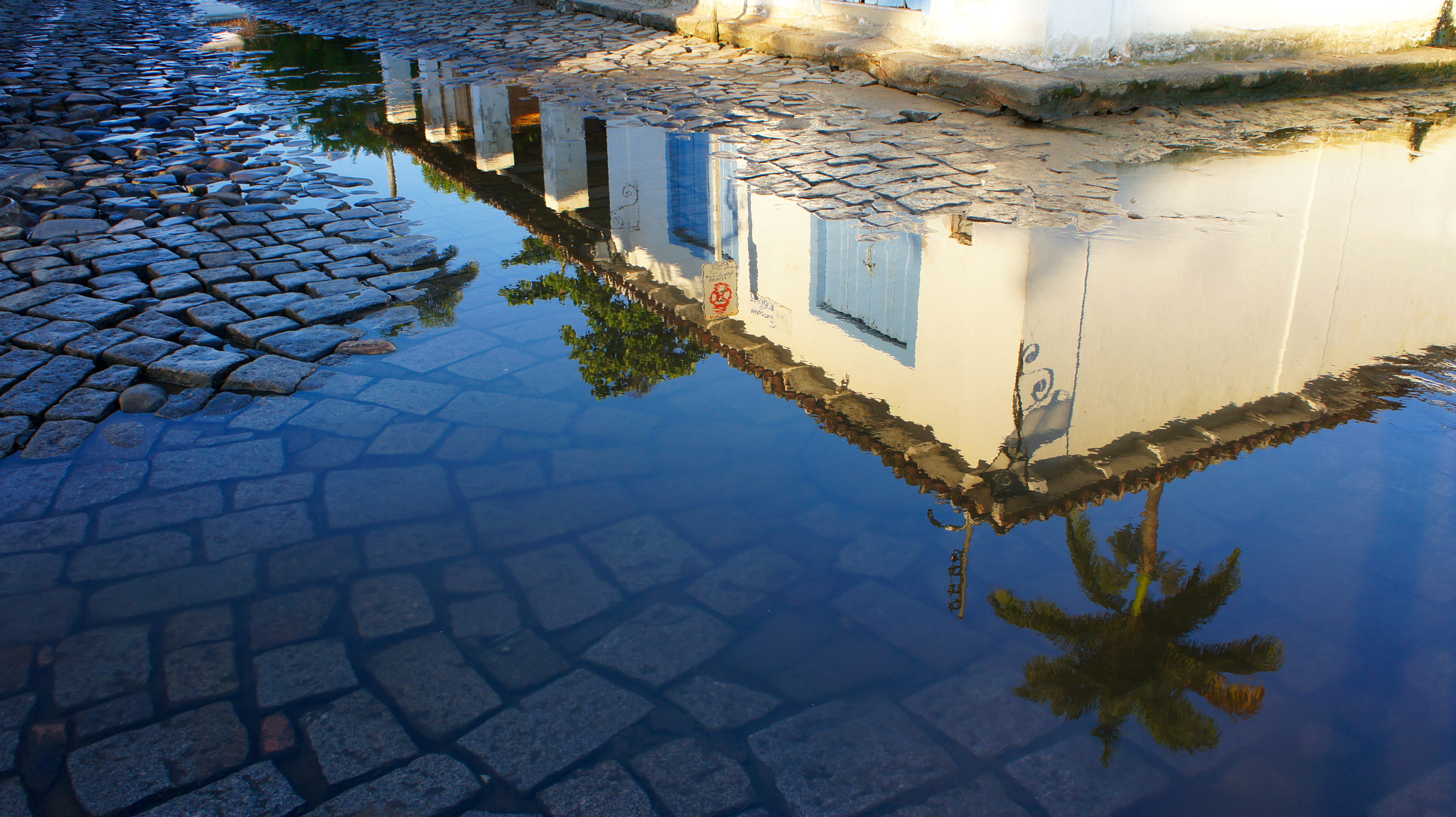 Tamron 18-200mm F3.5-6.3 Di III VC sample photo. Reflection of a colonial house on a water puddle photography