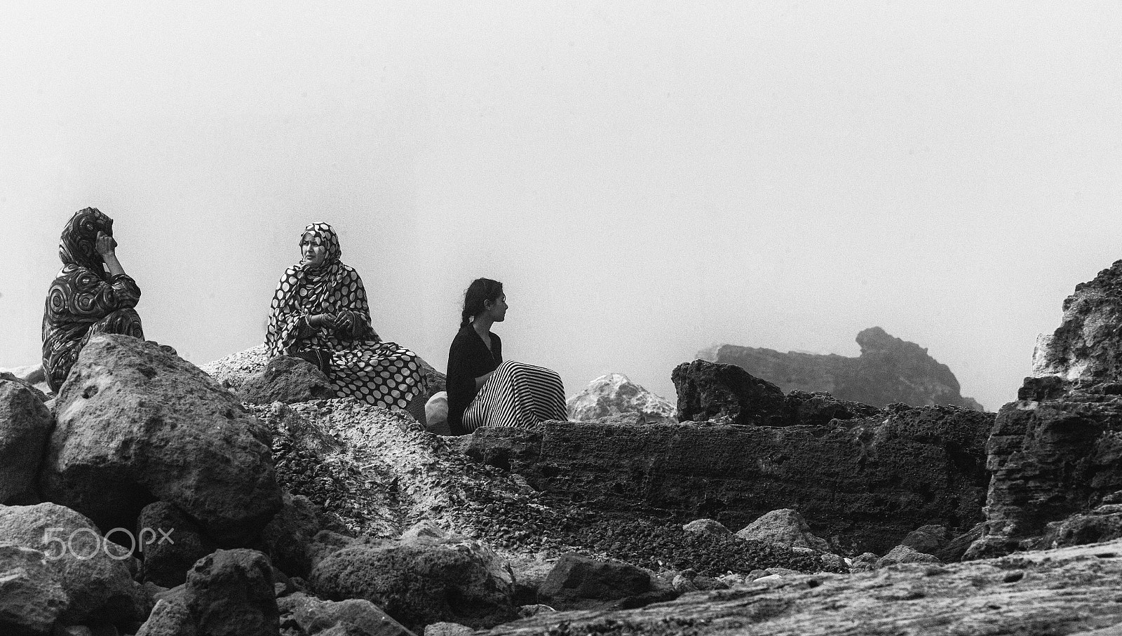Leica M9 + Elmarit-M 135mm f/2.8 (I/II) sample photo. 3 women sitting by the sea. photography