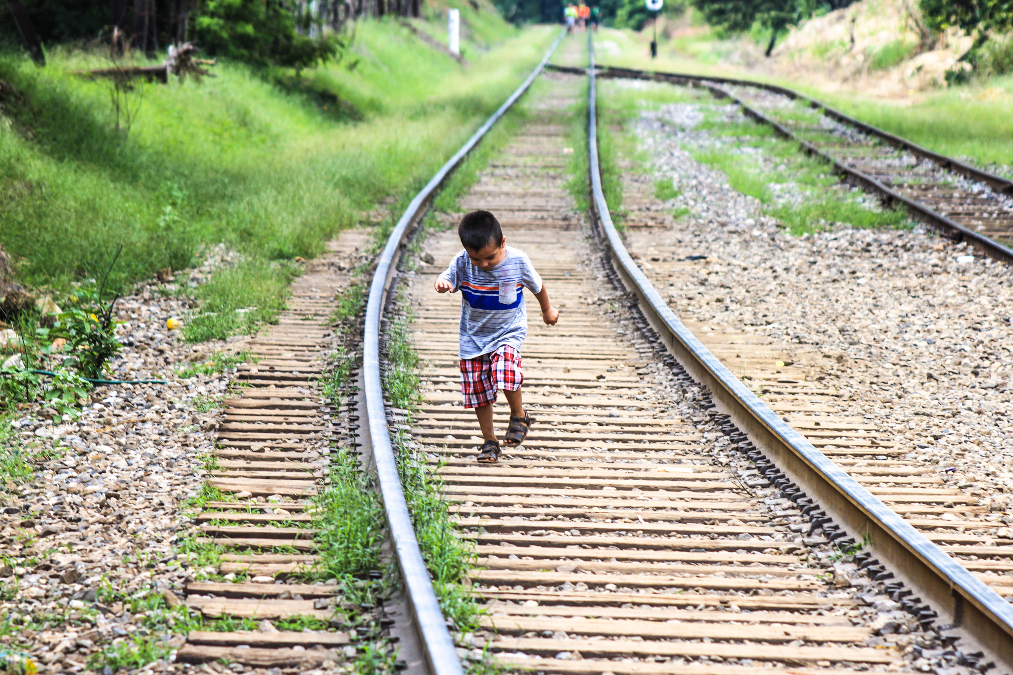 Canon EF 100-300mm F4.5-5.6 USM sample photo. Playing kid on track photography