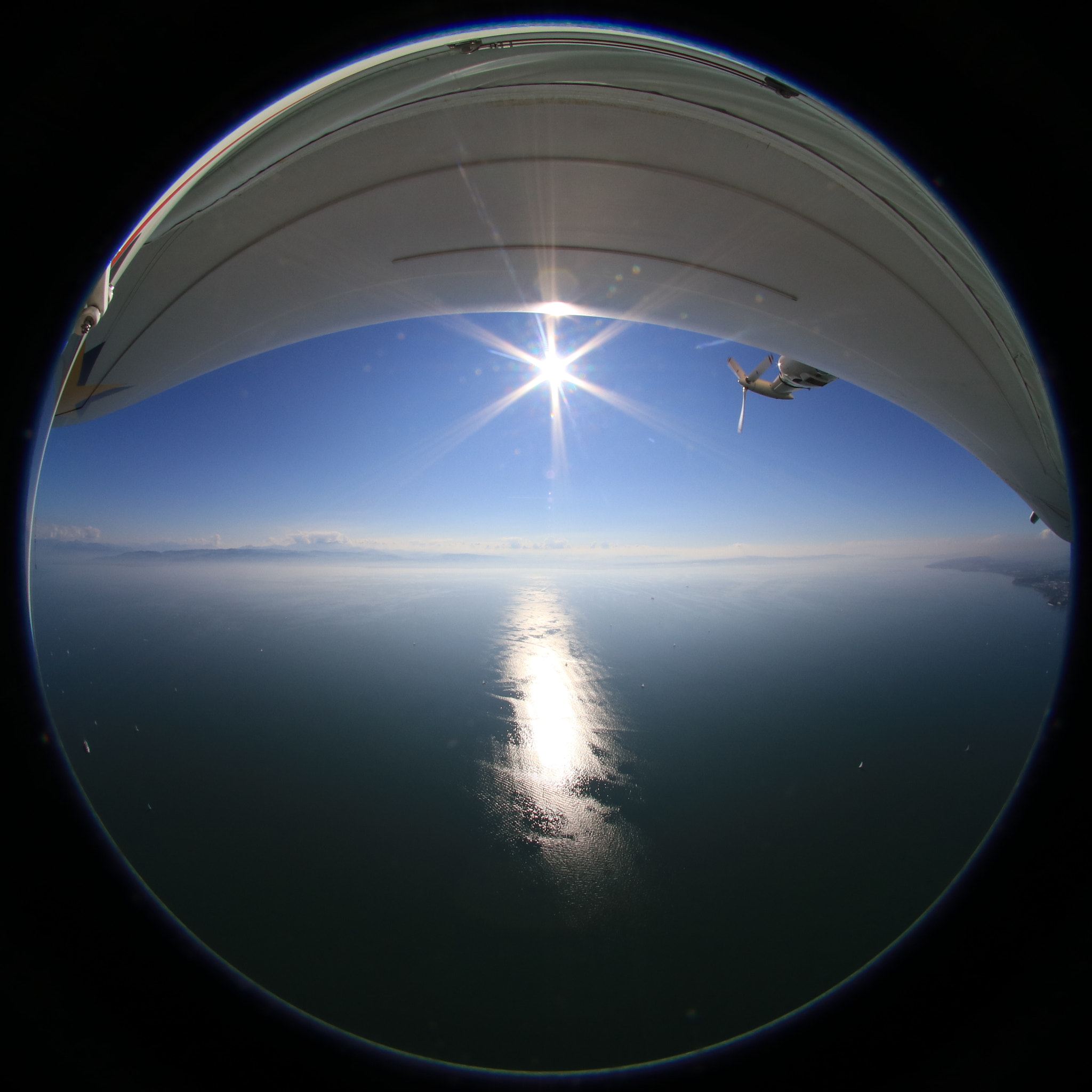 Canon EOS 80D + Sigma 4.5mm F2.8 EX DC HSM Circular Fisheye sample photo. View to lake bodensee from a zeppelin photography