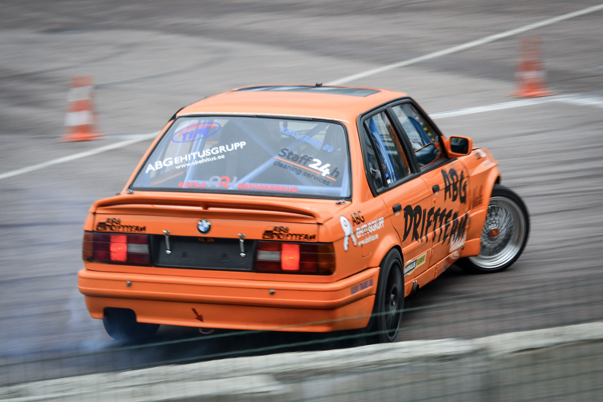 Nikon D3100 sample photo. Orange e30 in action photography