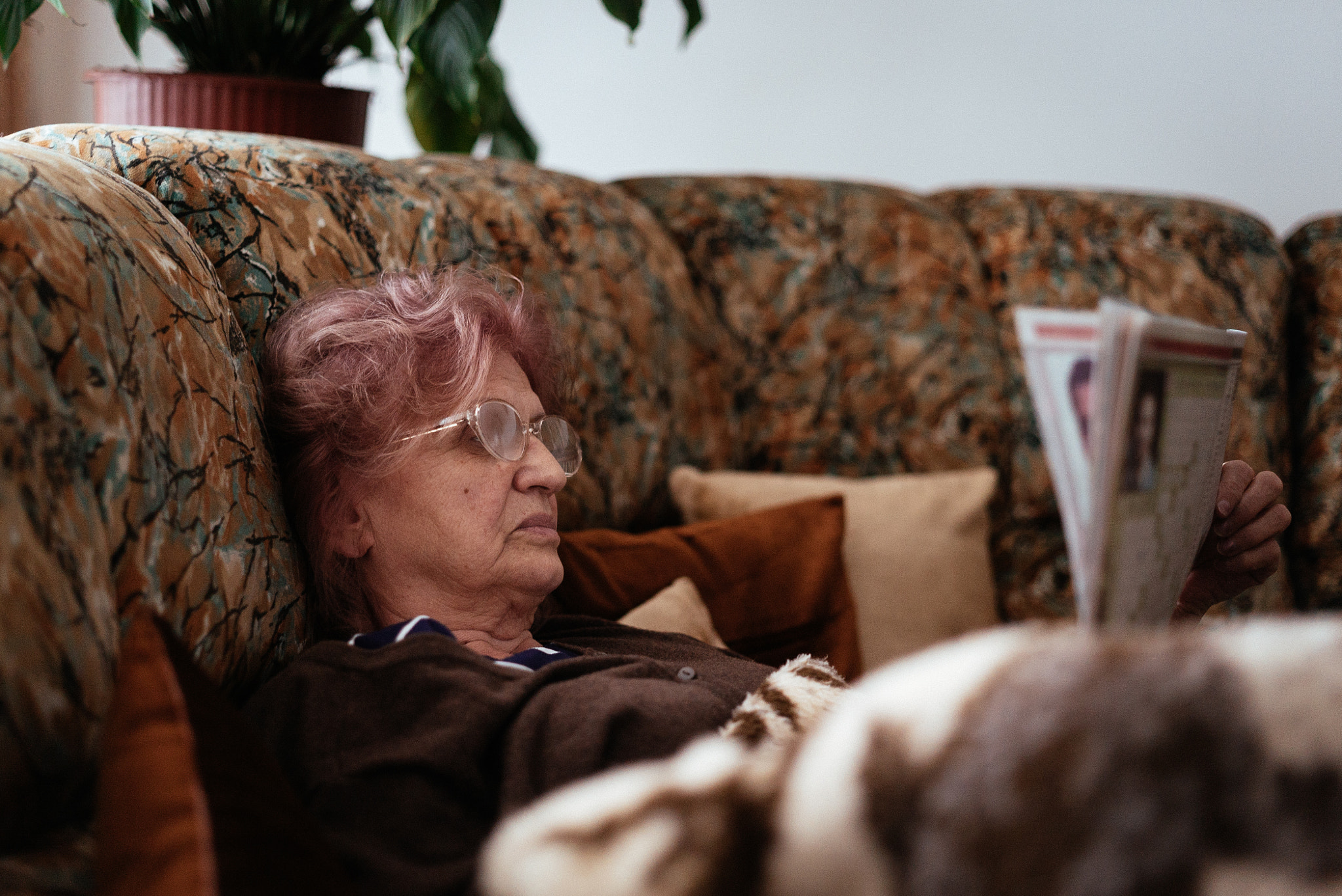 E 50mm F2 sample photo. Granny and her weekly dose of crossword photography