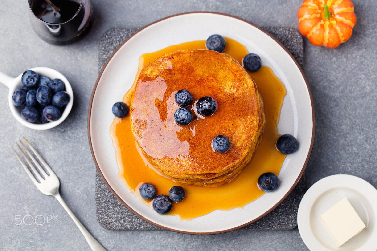 Canon EOS 5DS sample photo. Pumpkin pancakes with maple syrup and blueberries on a plate. grey stone background top view photography