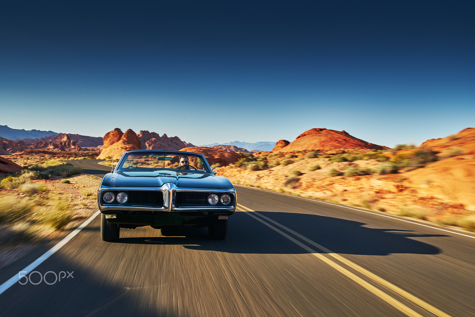 35mm F1.4 G SSM sample photo. Man driving vintage car through desert photography