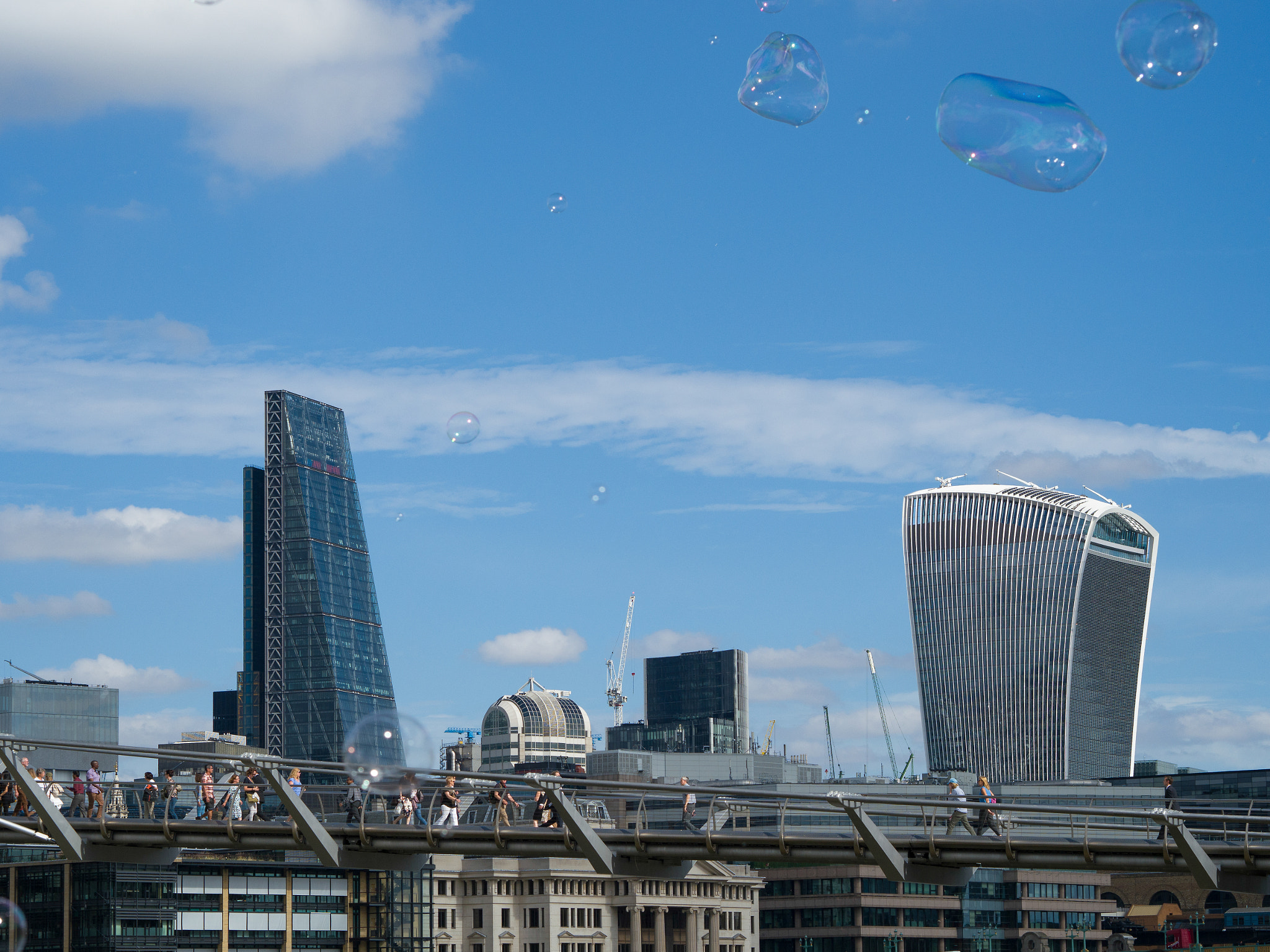 Olympus PEN-F + Olympus M.Zuiko Digital 45mm F1.8 sample photo. Bubbles blowing across the city of london skyline photography