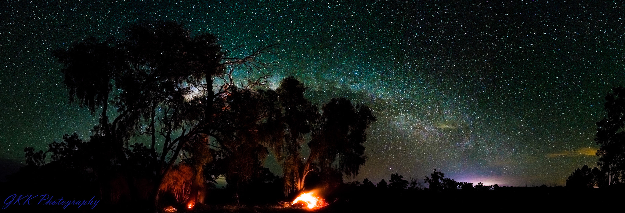 Nikon D5300 + Nikon AF-S DX Nikkor 10-24mm F3-5-4.5G ED sample photo. Burning trees and starry galaxy photography