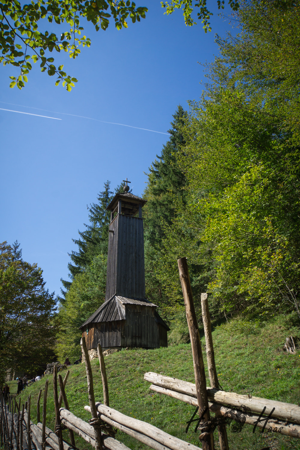 Sony E 18-200mm F3.5-6.3 OSS sample photo. Church surrounded by green photography