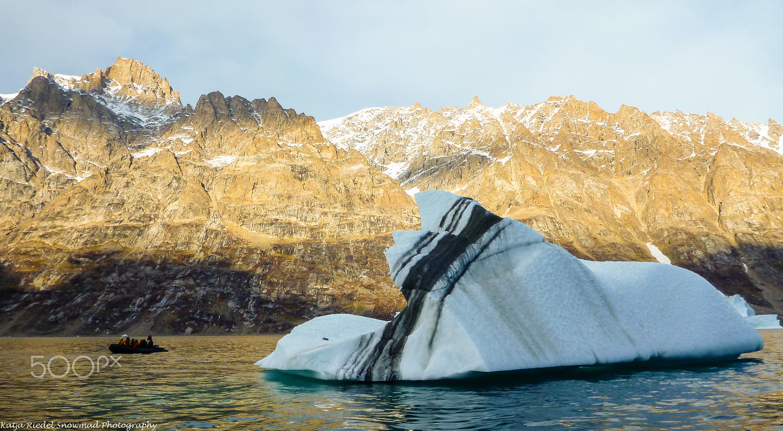 Panasonic DMC-FT4 sample photo. Small boat with stripy iceberg, greenland photography