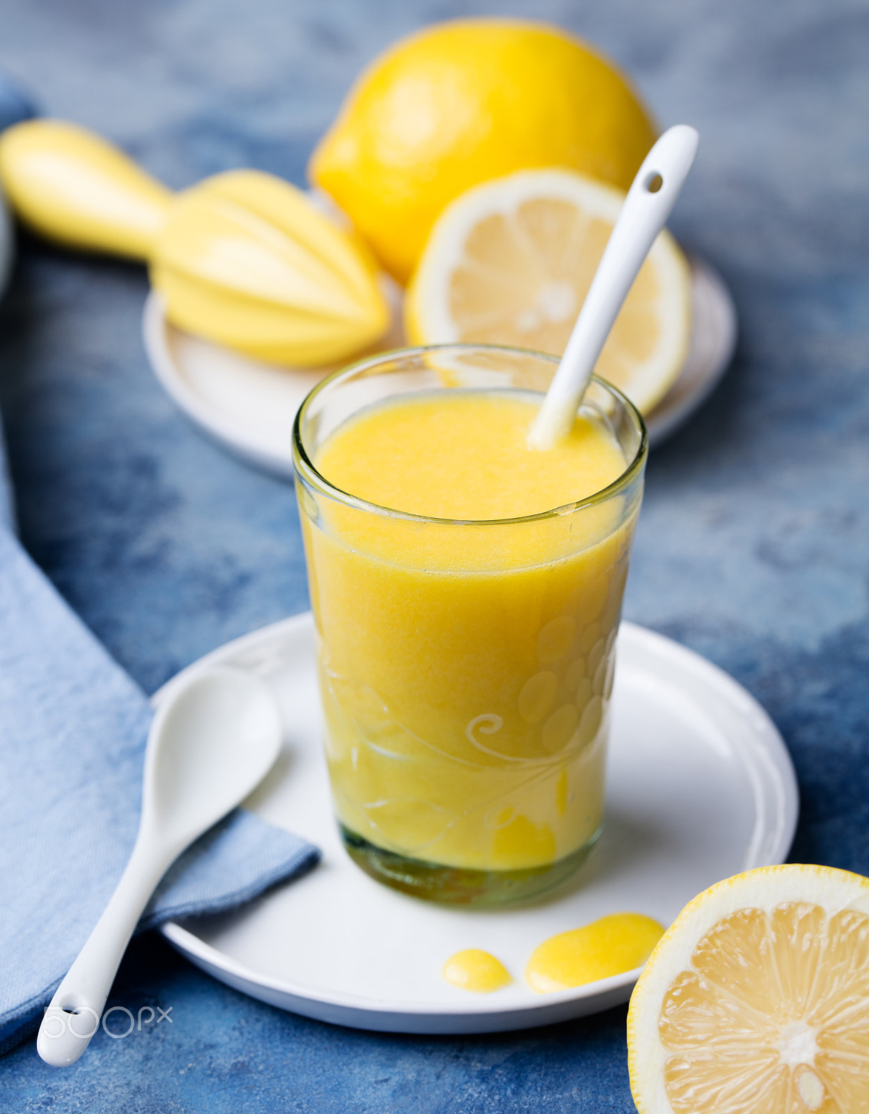 Canon EOS 5DS sample photo. Lemon curd in glass with fresh lemons blue stone background photography