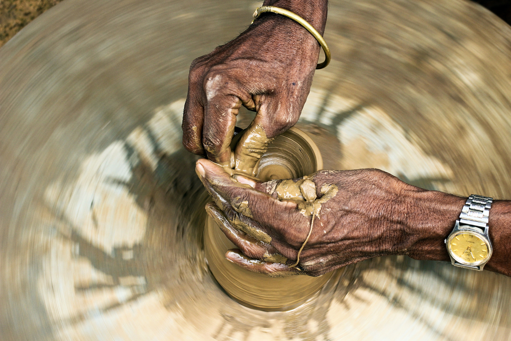 Canon EOS 60D + Canon EF 35mm F2 sample photo. Potter photography