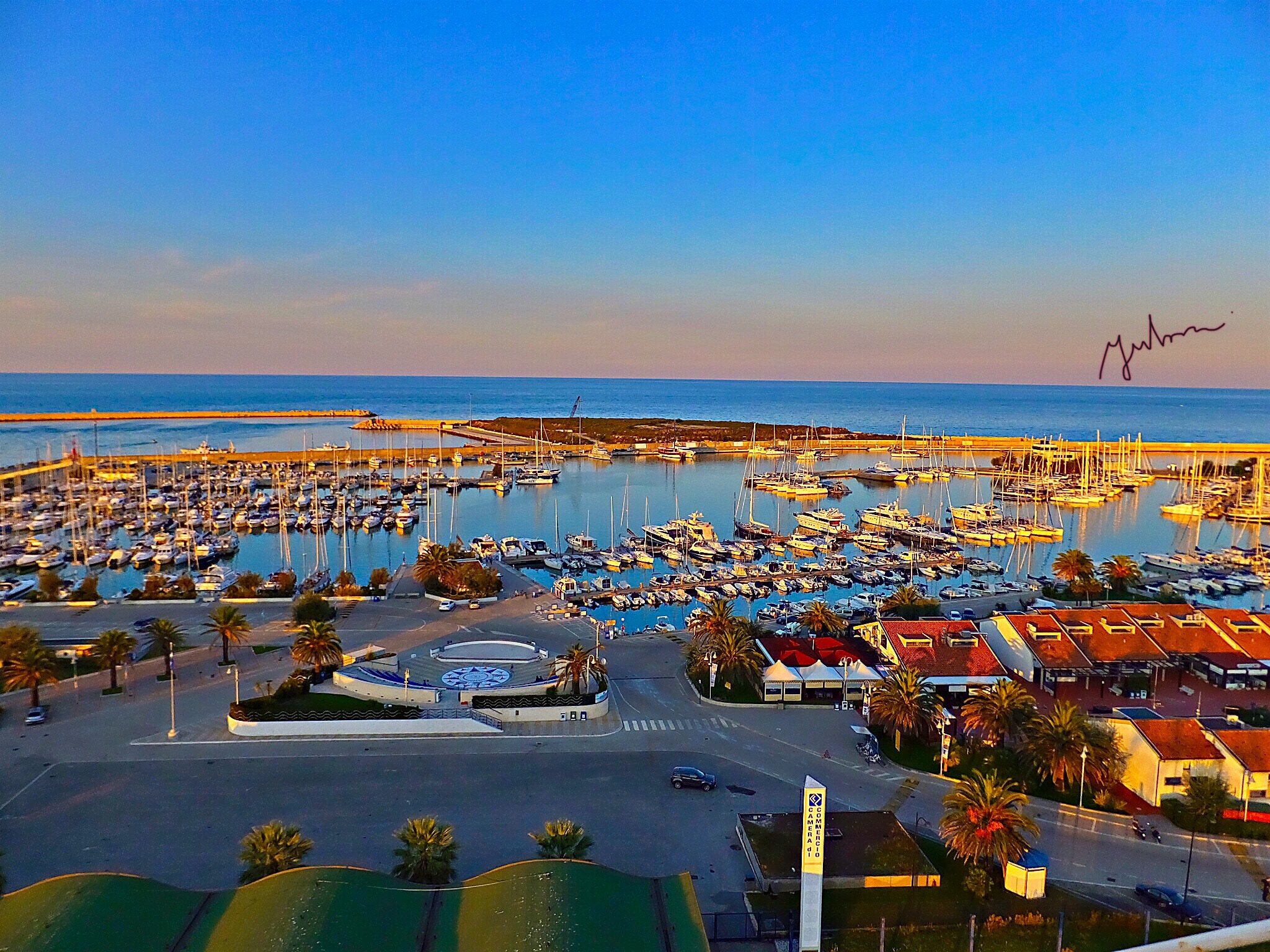 Fujifilm FinePix F900EXR sample photo. Sunset in marina of pescara ( views from the top of the ferris wheel ) photography