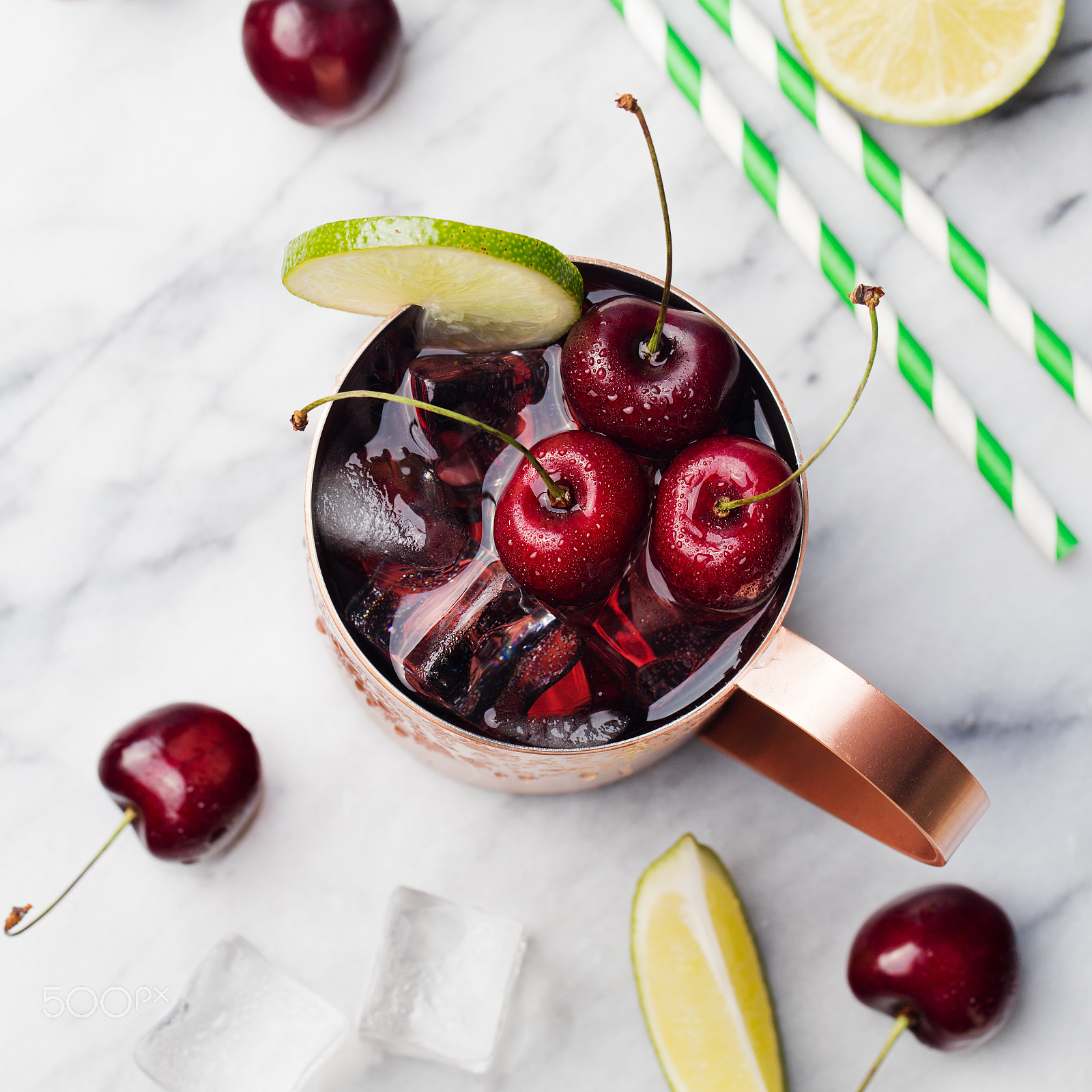 Canon EOS 5DS + Canon EF 100mm F2.8L Macro IS USM sample photo. Cold cherry moscow mules cocktail with ginger beer, vodka, lime marble background top view photography