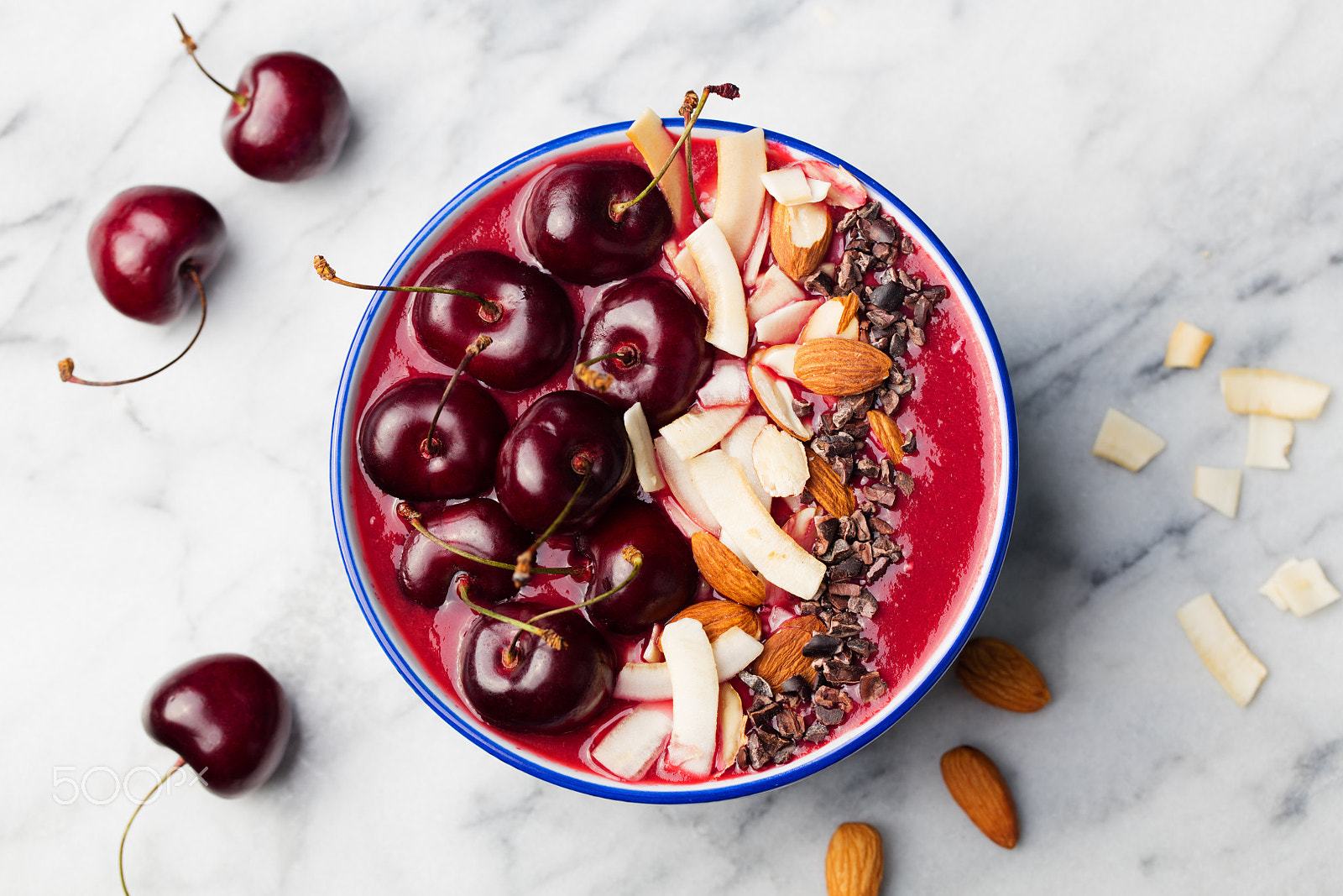 Canon EOS 5DS + Canon EF 100mm F2.8L Macro IS USM sample photo. Smoothie bowl with fresh black cherries, coconut flakes, almond. marble background. top view. photography