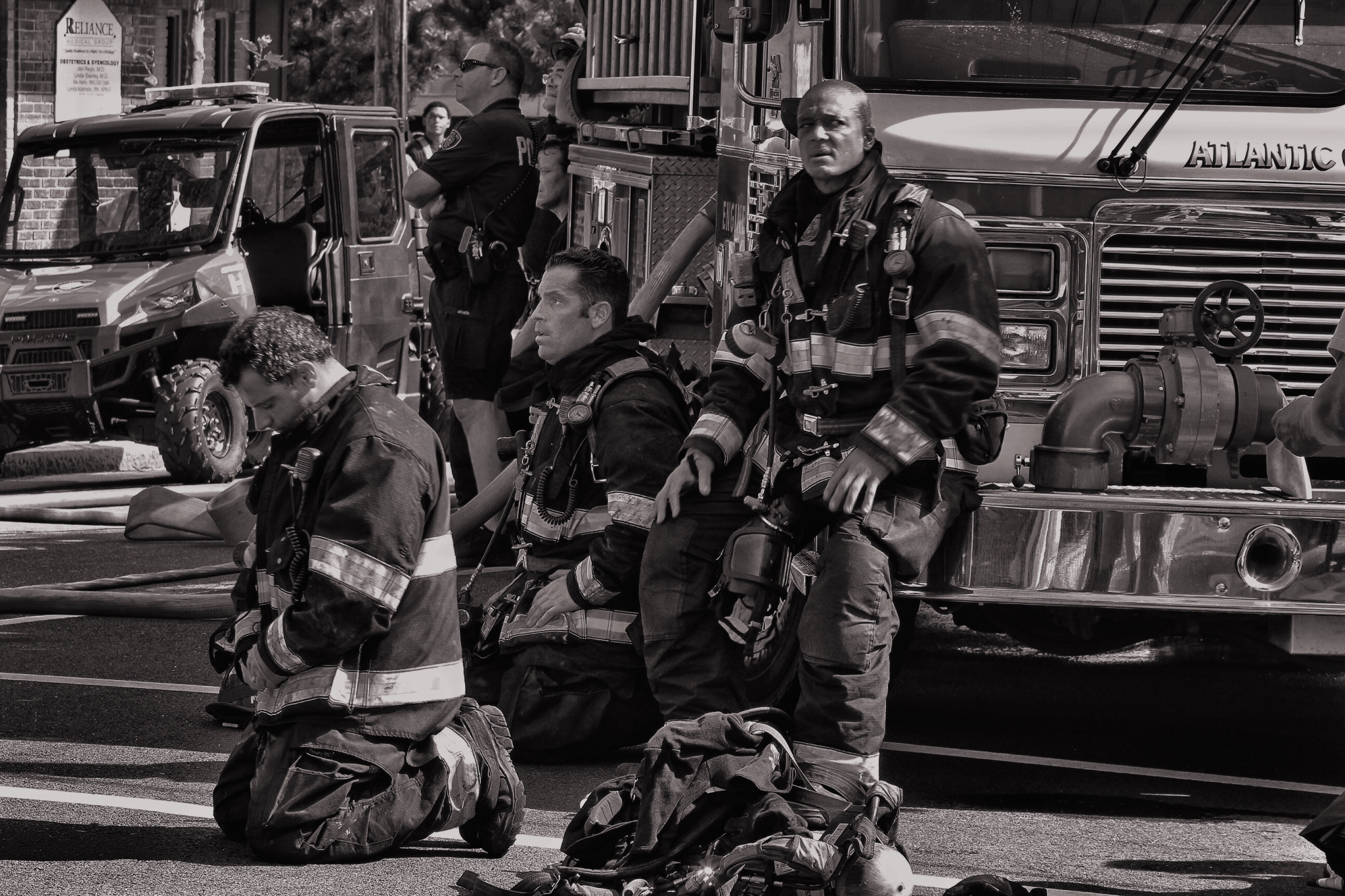 Canon EF 70-300mm F4-5.6L IS USM sample photo. Firefighters in black and white photography