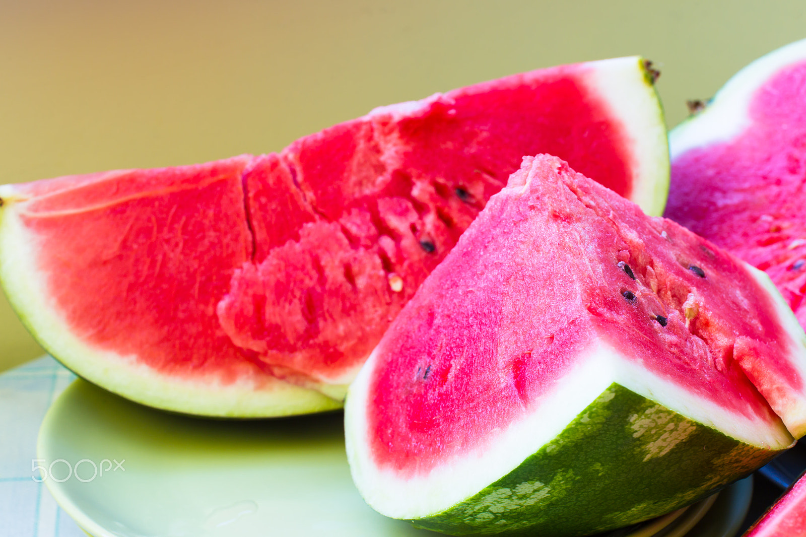 Canon EOS-1D Mark IV sample photo. A piece of juicy ripe watermelon with fleshy pink flesh on a lig photography