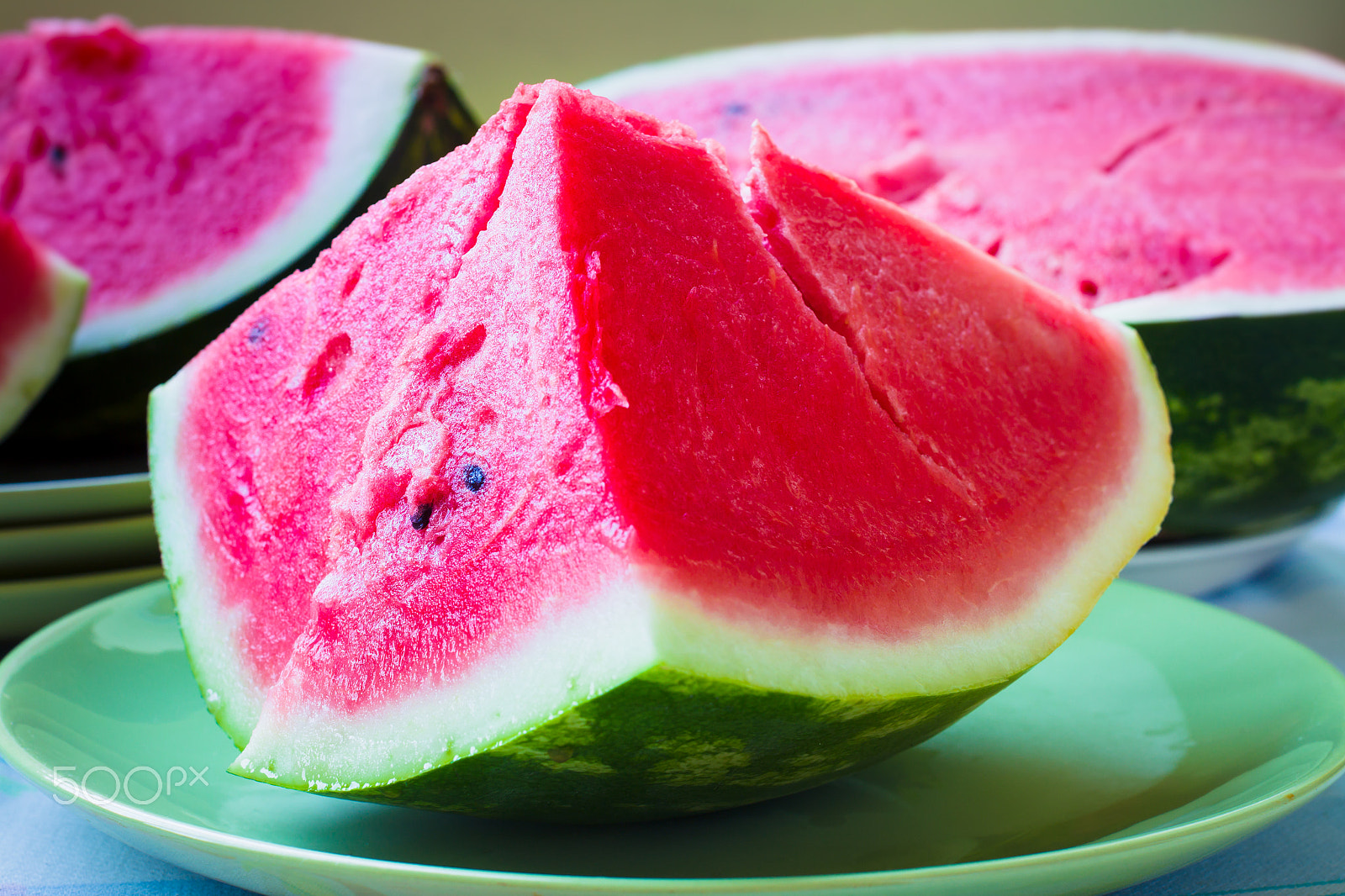 Canon EOS-1D Mark IV sample photo. A piece of juicy ripe watermelon with fleshy pink flesh on a lig photography