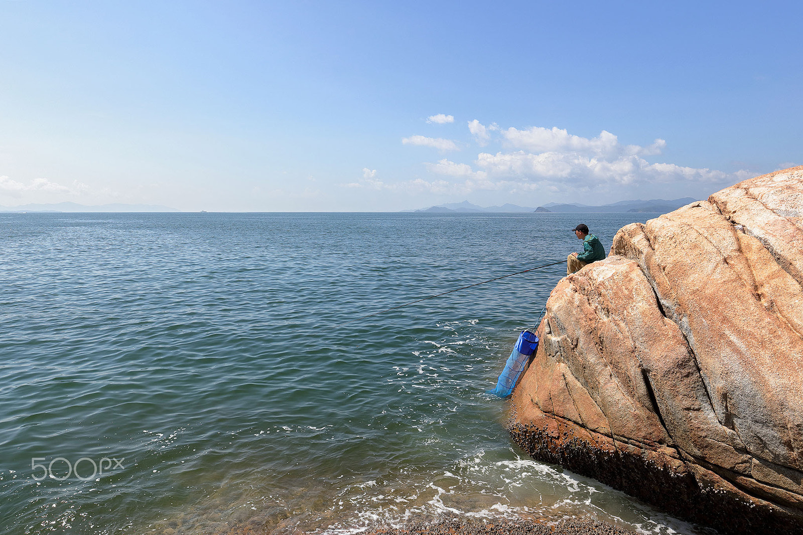 Canon EOS 5DS + Canon EF 16-35mm F4L IS USM sample photo. A man fishing alone photography