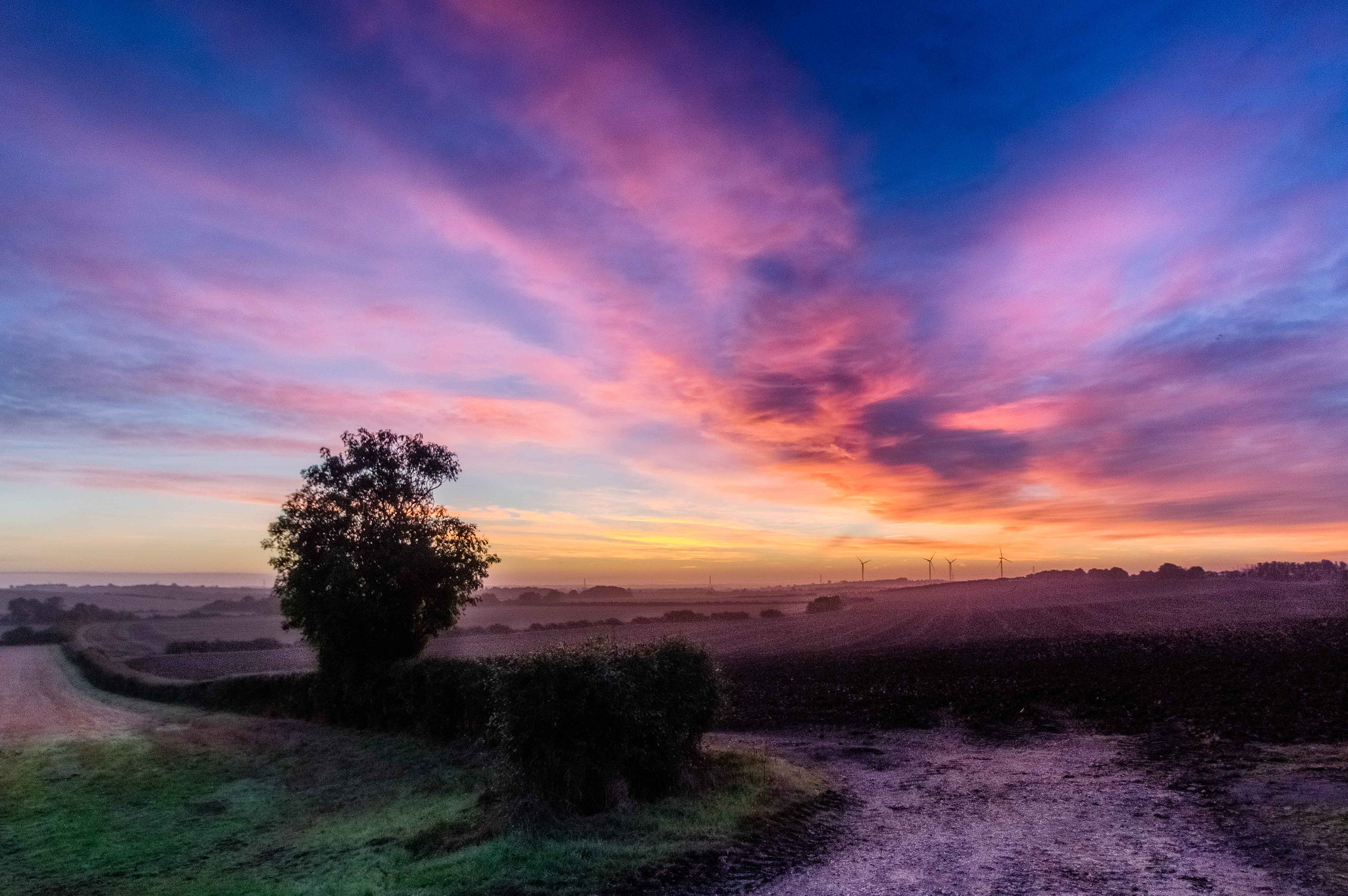 Pentax K-3 II sample photo. Sunrise in cambridgeshire. an enormous cloud 'hand', grasping at the fleeing darkness photography