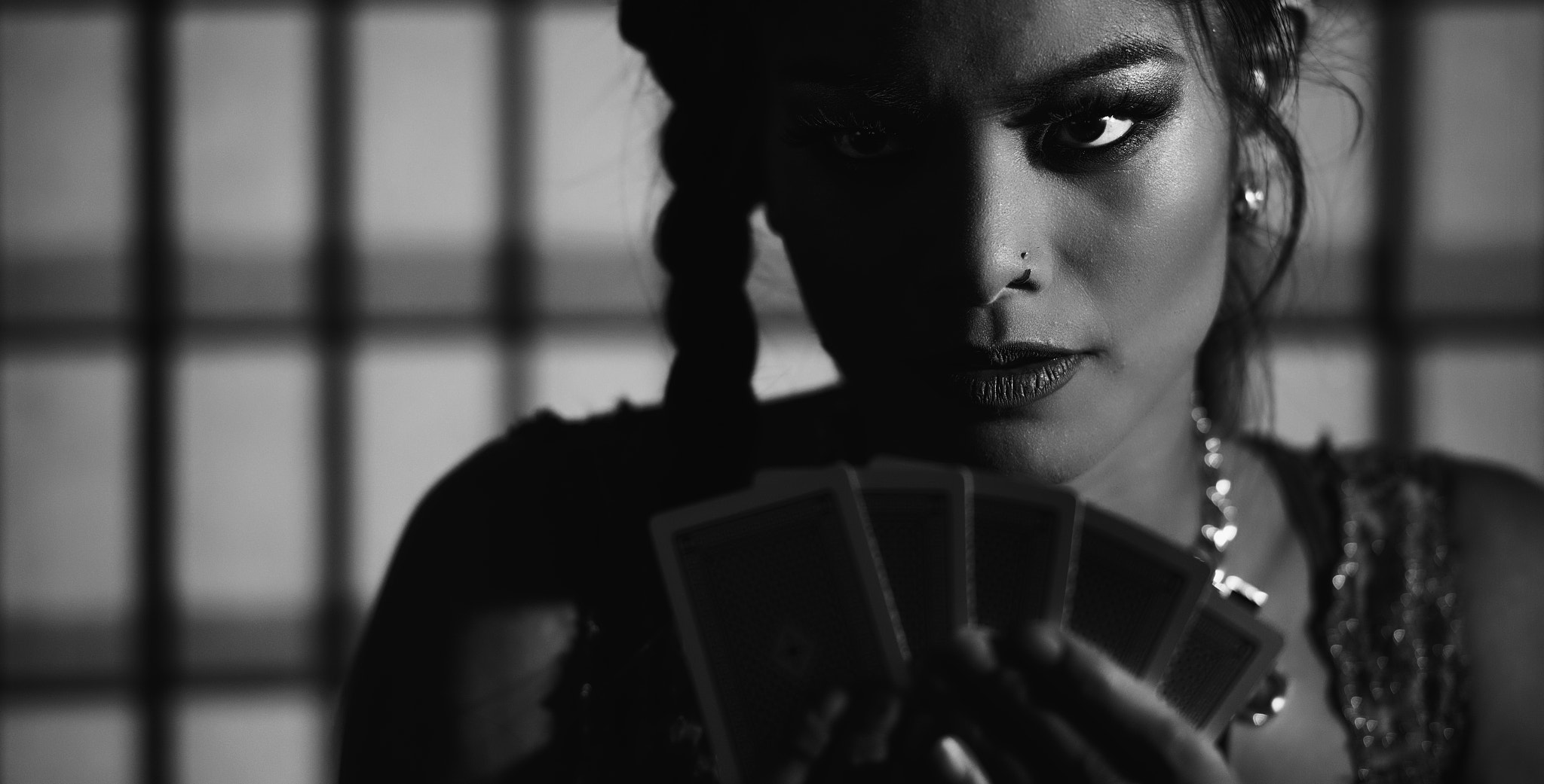 Female poker player. Black and white.