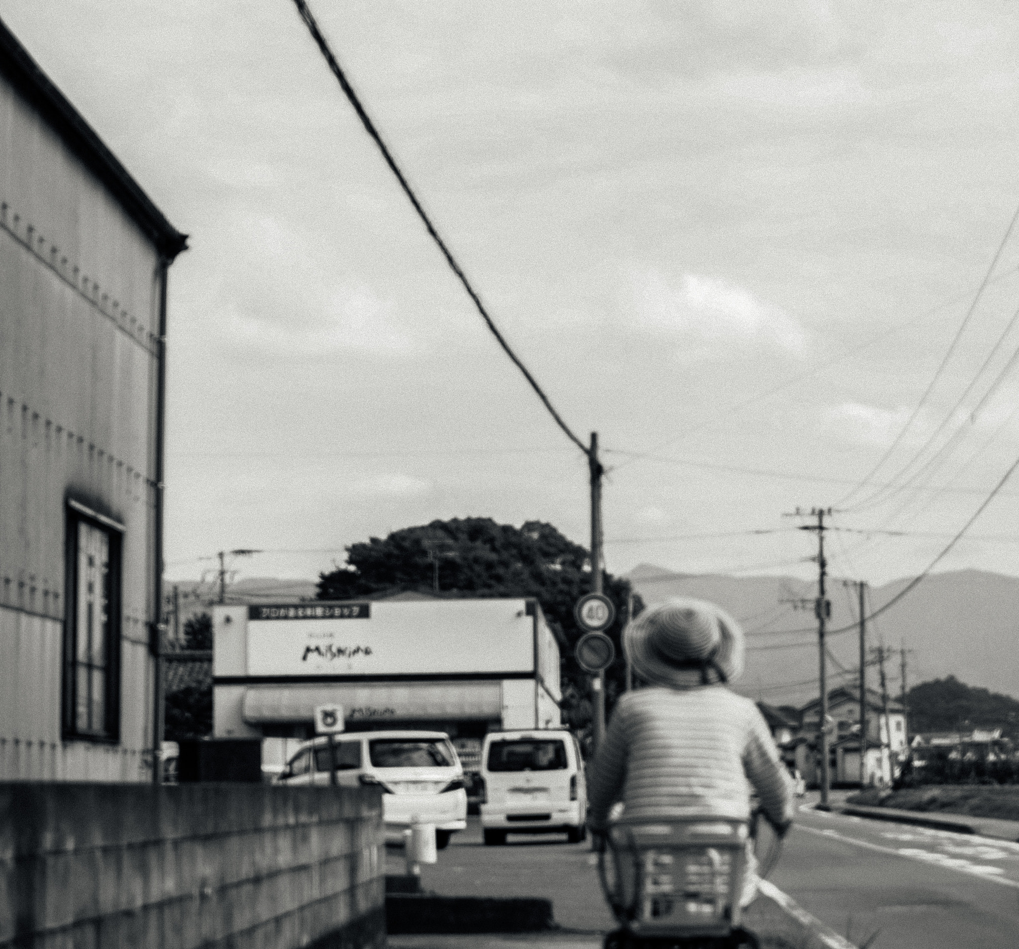 Sony a7S sample photo. Japanese woman riding bycicle photography
