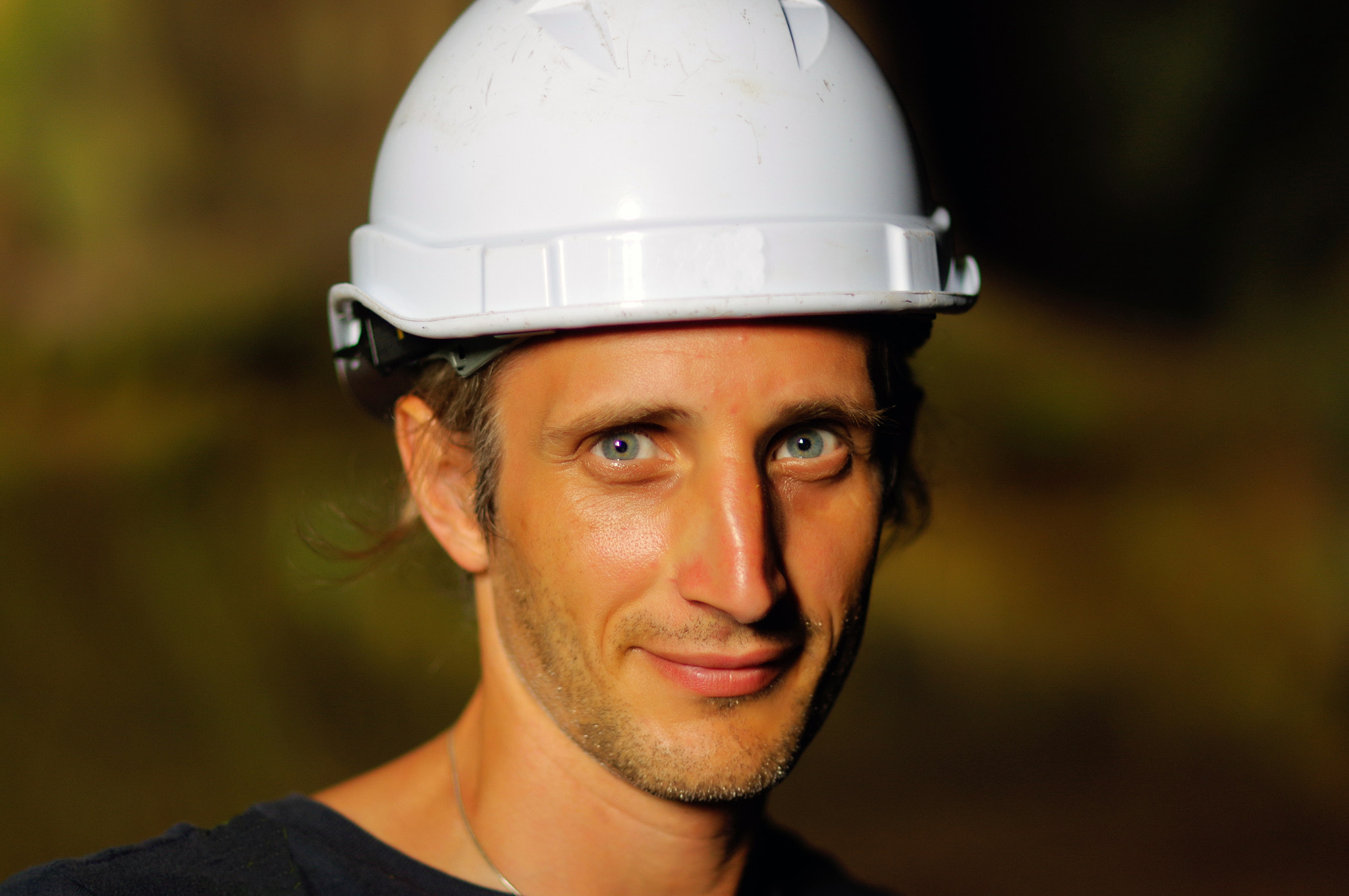 Pentax K-3 sample photo. Portrait of a worker with white helmet on head,  nature backgrou photography