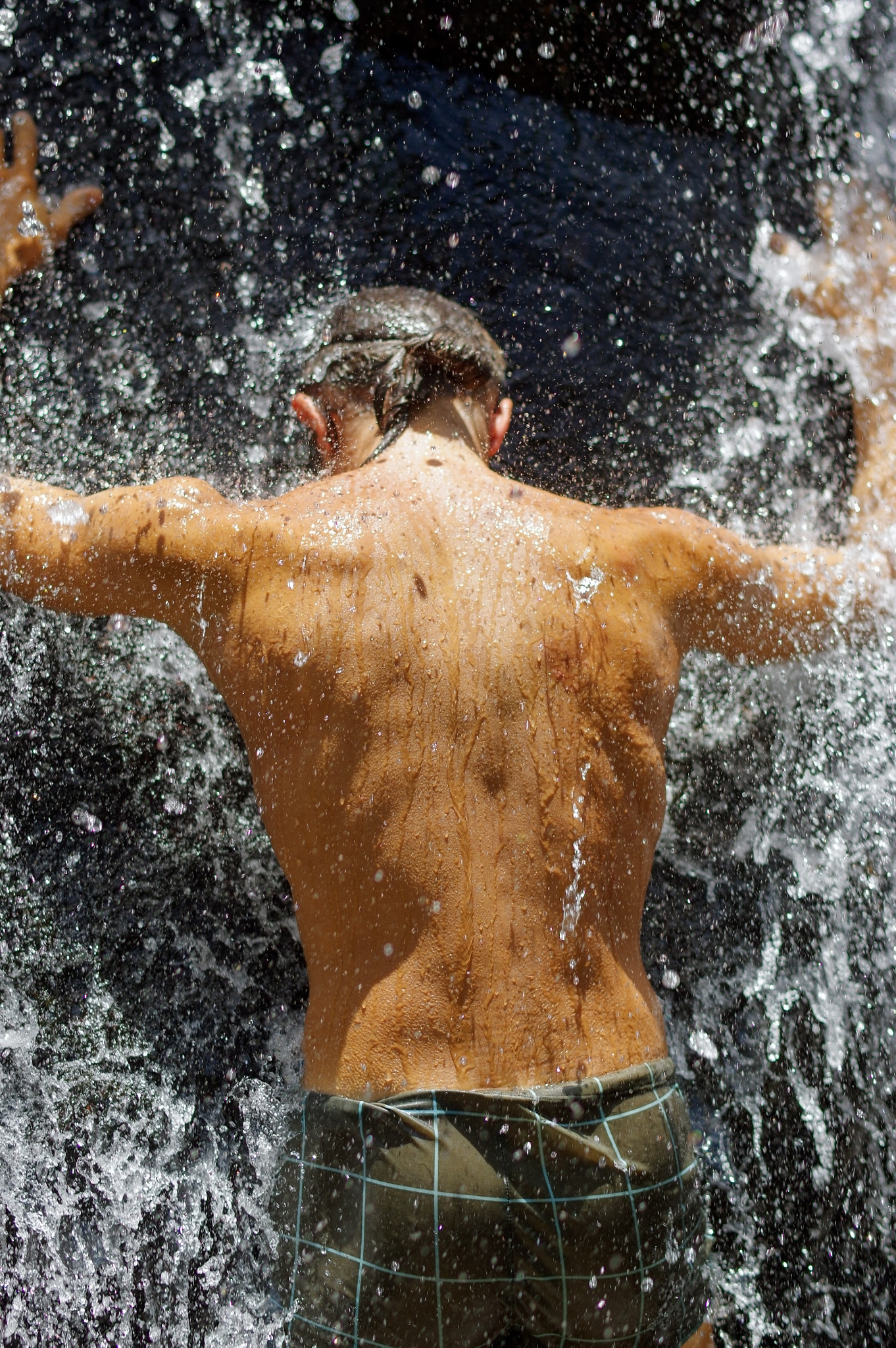 Pentax K-3 + Pentax smc DA* 55mm F1.4 SDM sample photo. Man taking a relaxing shower under waterfall. outside photography