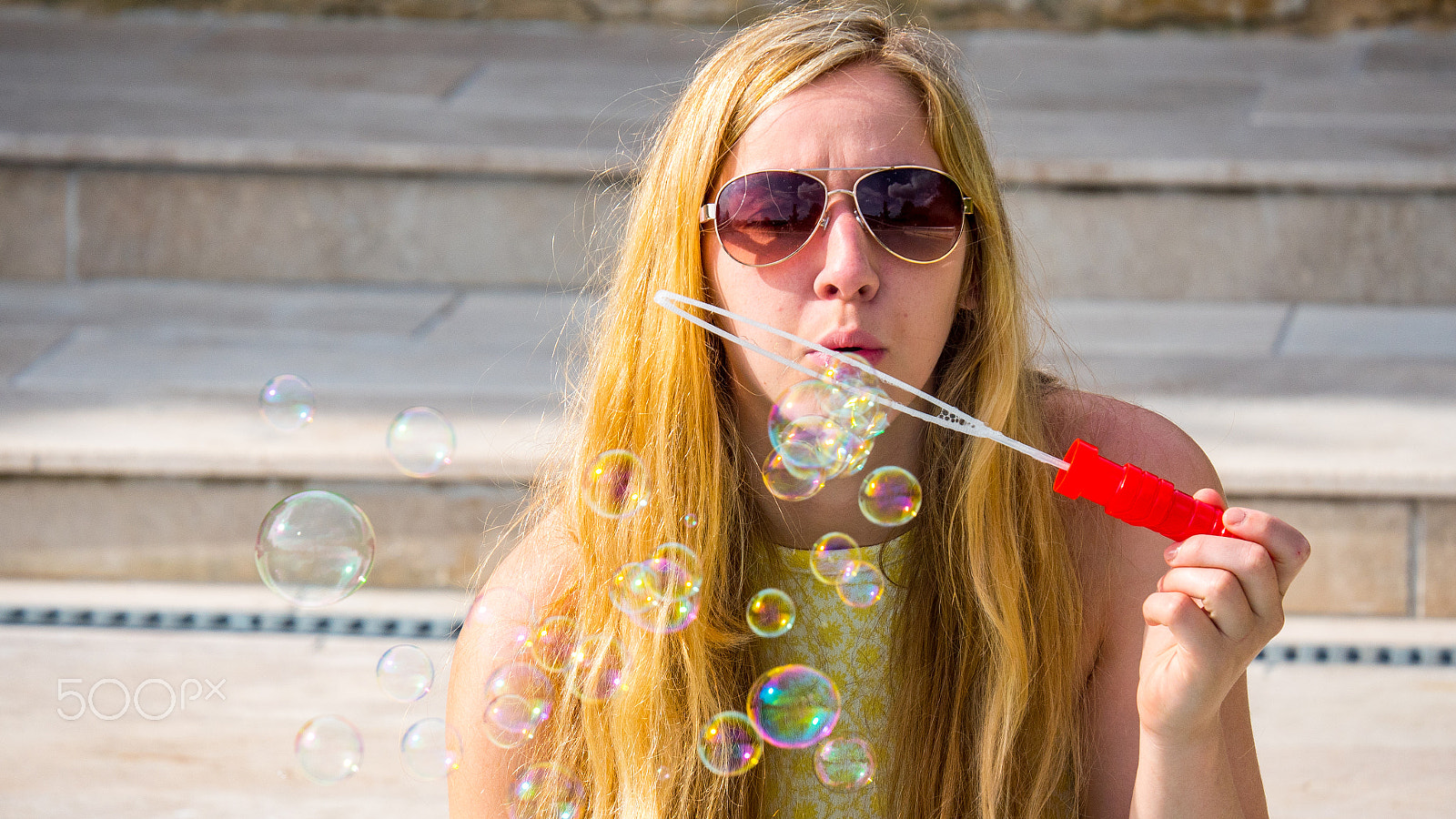 LUMIX G VARIO 45-150/F4.0-5.6 sample photo. Girl blowing bubbles at the pool photography