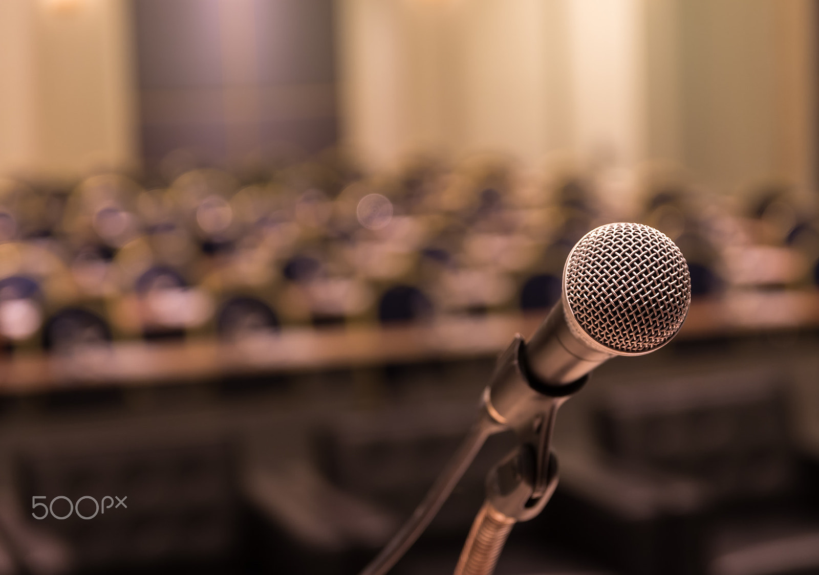 Pentax K-5 IIs sample photo. Microphone over the abstract blurred photo of conference hall or photography